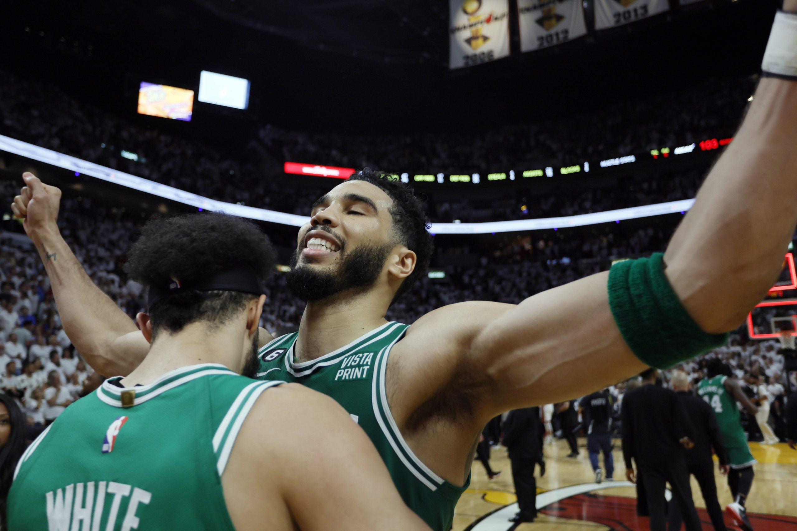 May 27, 2023; Miami, Florida, USA; Boston Celtics guard Derrick White (9) celebrates with forward Jayson Tatum (0) after defeating the Miami Heat in game six of the Eastern Conference Finals for the 2023 NBA playoffs at Kaseya Center. Mandatory Credit: Sam Navarro-USA TODAY Sports