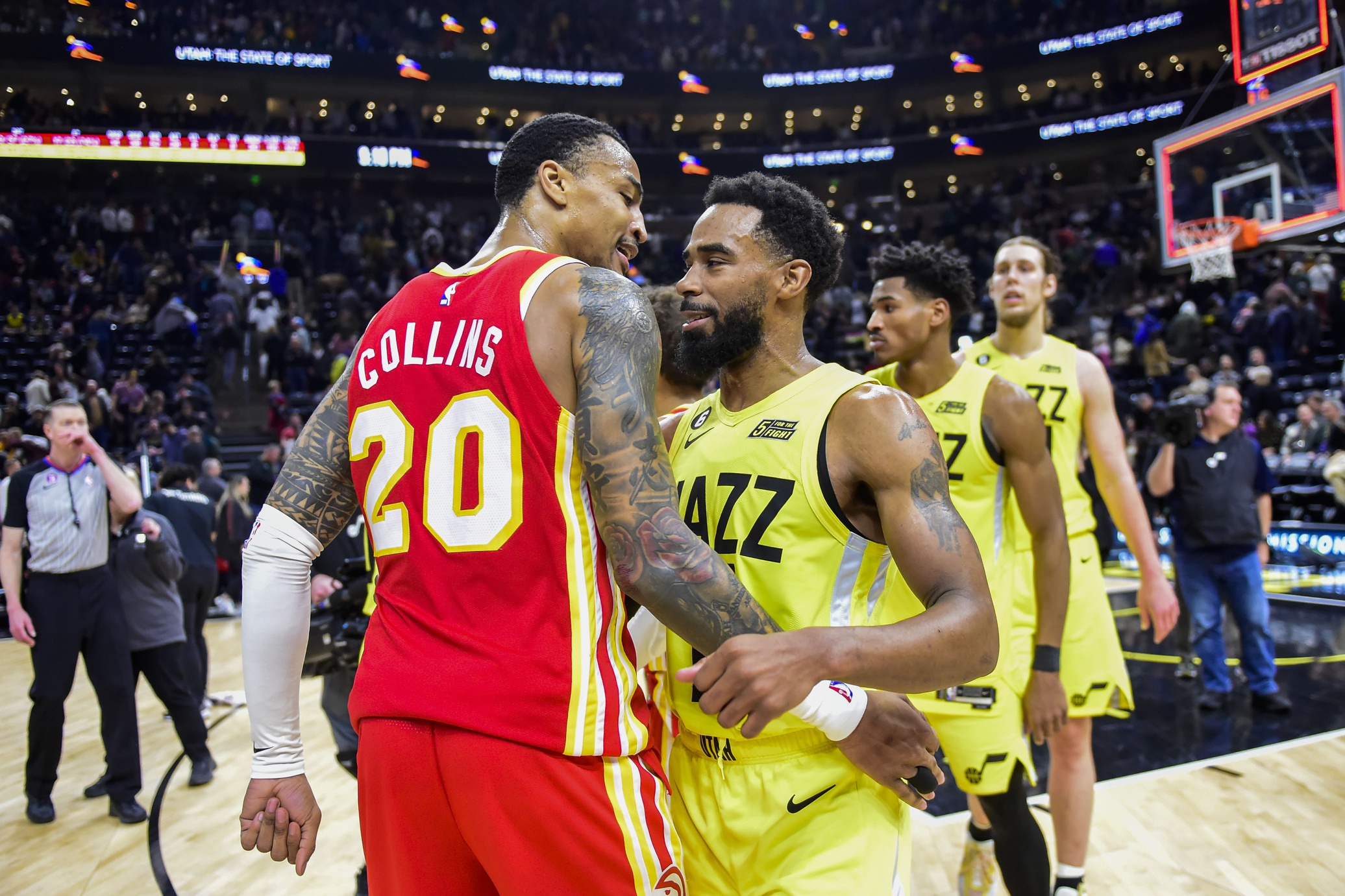 Feb 3, 2023; Salt Lake City, Utah, USA; Utah Jazz guard Mike Conley (11) congratulates Atlanta Hawks forward/center John Collins (20) on their win at Vivint Arena. Mandatory Credit: Christopher Creveling-USA TODAY Sports