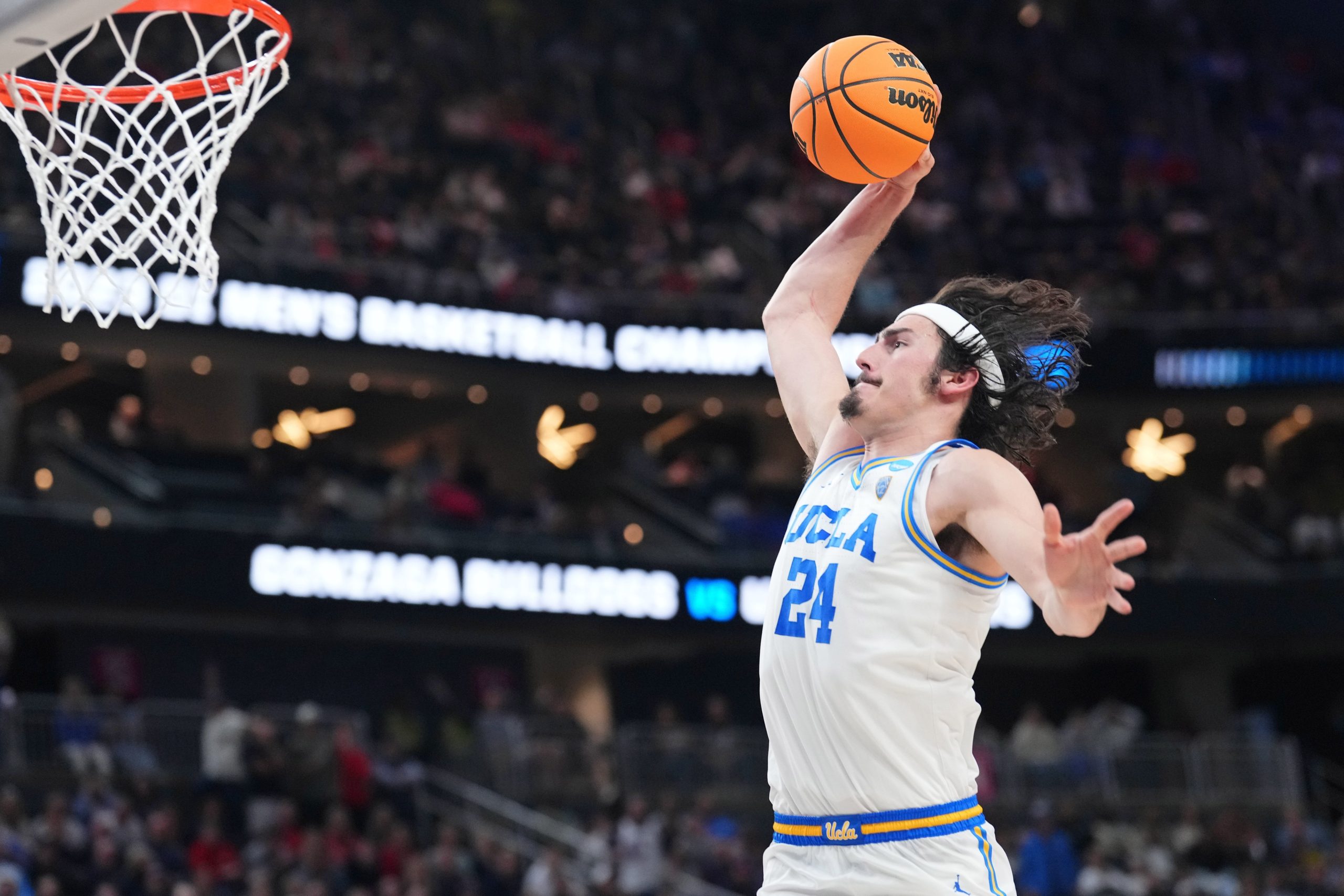 Mar 23, 2023; Las Vegas, NV, USA; UCLA Bruins guard Jaime Jaquez Jr. (24) dunks against the Gonzaga Bulldogs during the first half at T-Mobile Arena. Mandatory Credit: Joe Camporeale-USA TODAY Sports