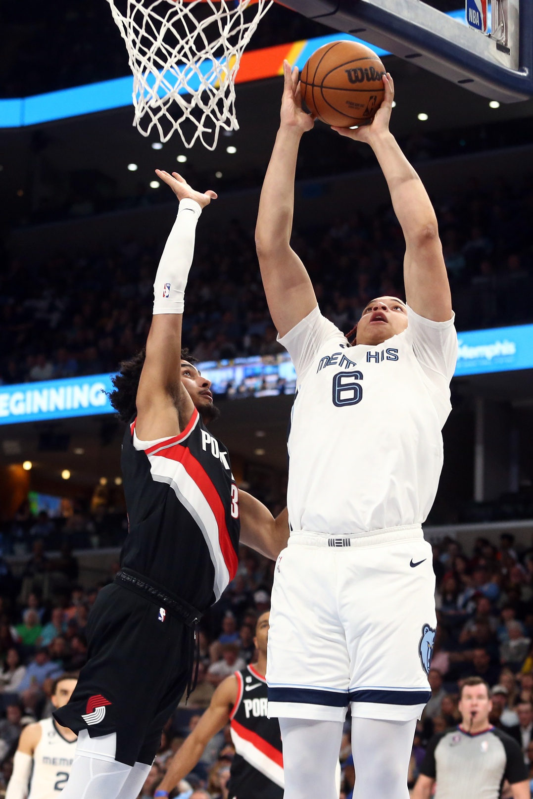 Apr 4, 2023; Memphis, Tennessee, USA; Memphis Grizzlies forward Kenneth Lofton Jr. (6) shoots as Portland Trail Blazers forward Justin Minaya (35) defends during the second half at FedExForum. Mandatory Credit: Petre Thomas-USA TODAY Sports