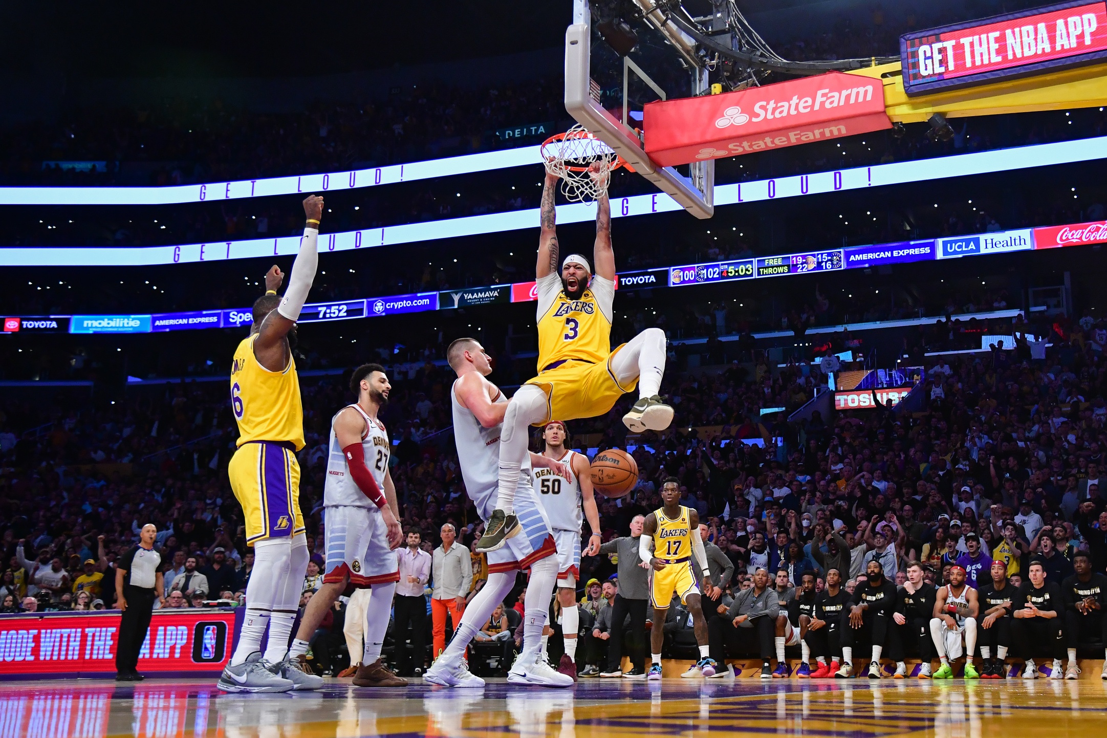 May 22, 2023; Los Angeles, California, USA; Los Angeles Lakers forward Anthony Davis (3) dunks the ball against Denver Nuggets center Nikola Jokic (15) during the fourth quarter in game four of the Western Conference Finals for the 2023 NBA playoffs at Crypto.com Arena. Mandatory Credit: Gary A. Vasquez-USA TODAY Sports