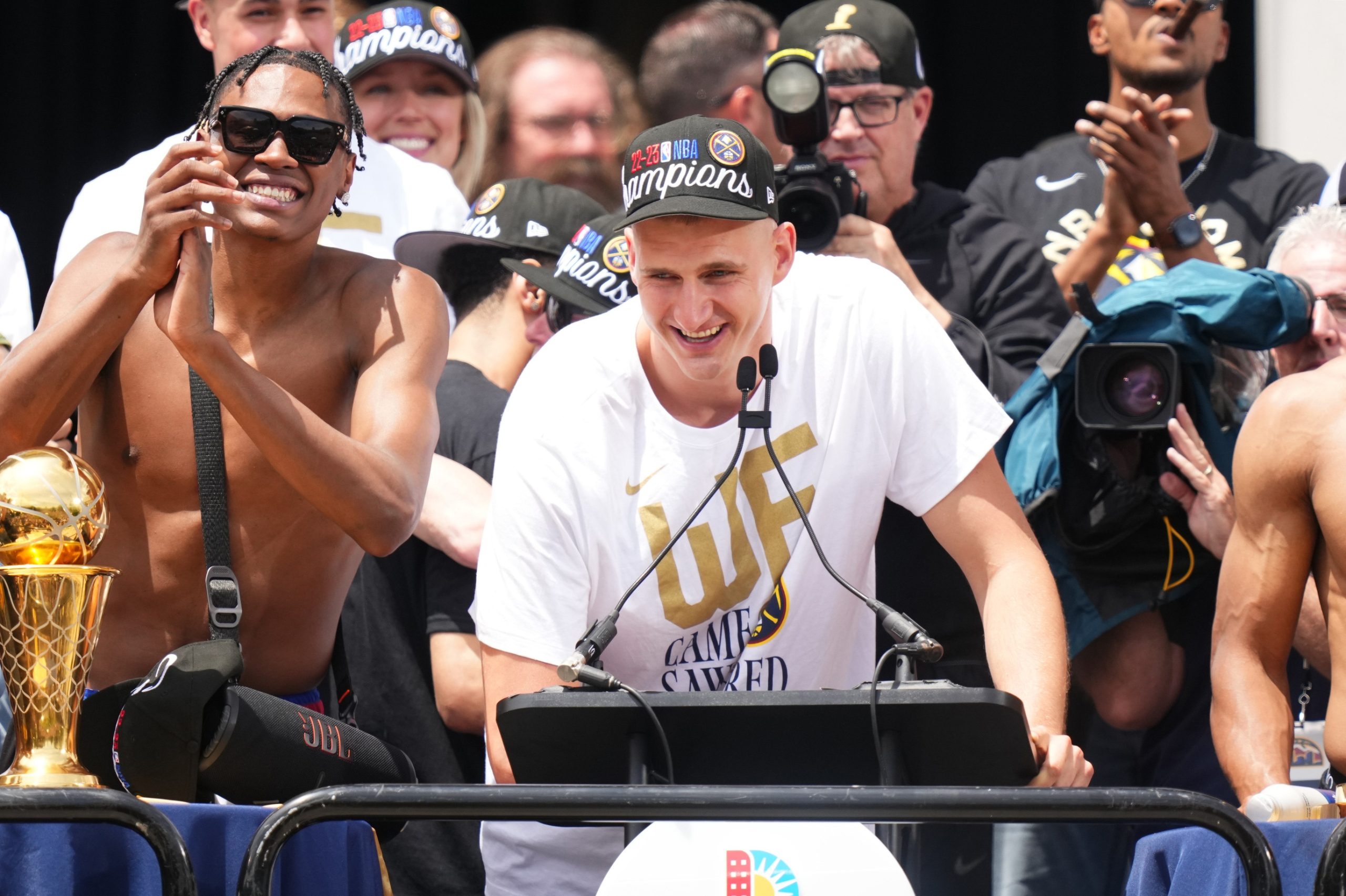 Jun 15, 2023; Denver, CO, USA; Denver Nuggets center Nikola Jokic (15) speaks during the championship parade after the Denver Nuggets won the 2023 NBA Finals. Mandatory Credit: Ron Chenoy-USA TODAY Sports