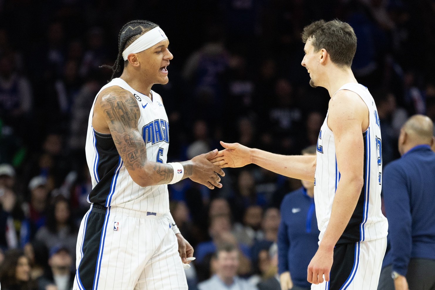 Jan 30, 2023; Philadelphia, Pennsylvania, USA; Orlando Magic forward Paolo Banchero (5) and forward Franz Wagner (22) celebrate a score against the Philadelphia 76ers during the fourth quarter at Wells Fargo Center. Mandatory Credit: Bill Streicher-USA TODAY Sports