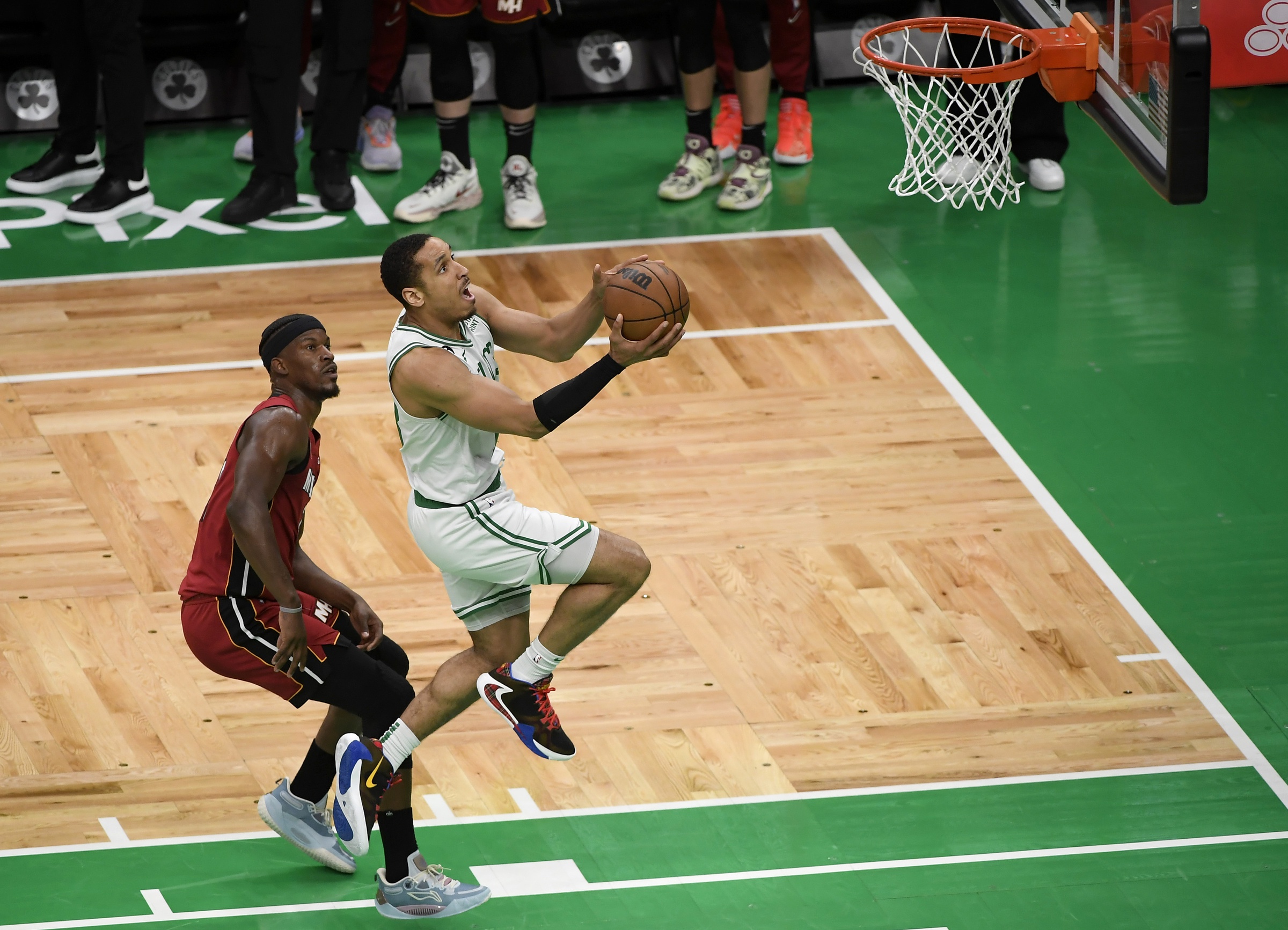 May 19, 2023; Boston, Massachusetts, USA; Boston Celtics guard Malcolm Brogdon (13) shoots past Miami Heat forward Jimmy Butler (22) during the second half of game two of the Eastern Conference Finals for the 2023 NBA playoffs at TD Garden. Mandatory Credit: Bob DeChiara-USA TODAY Sports. He is recent Boston Celtic trade news from this past week.