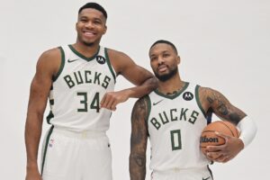 Oct 2, 2023; Milwaukee, WI, USA; Milwaukee Bucks forward Giannis Antetokounmpo (34) and guard Damian Lillard (0) pose for a picture during media day in Milwaukee. Mandatory Credit: Benny Sieu-USA TODAY Sports