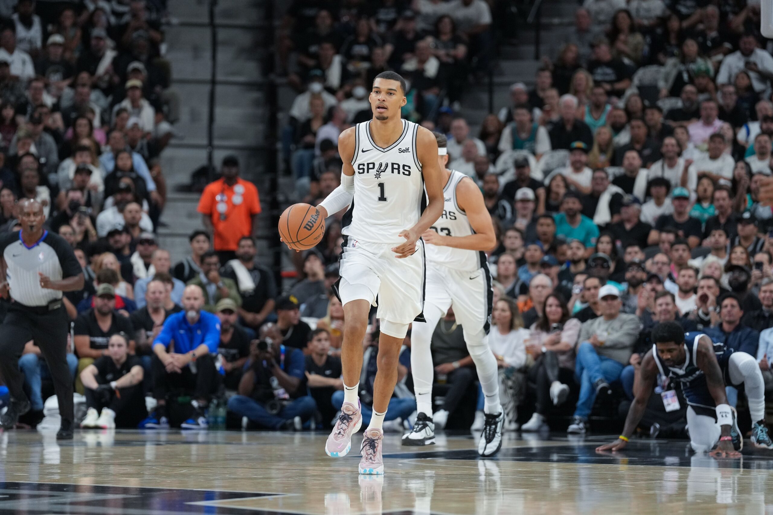 Oct 25, 2023; San Antonio, Texas, USA; San Antonio Spurs center Victor Wembanyama (1) dribbles up the court in the first half against the Dallas Mavericks at the Frost Bank Center. Mandatory Credit: Daniel Dunn-USA TODAY Sports