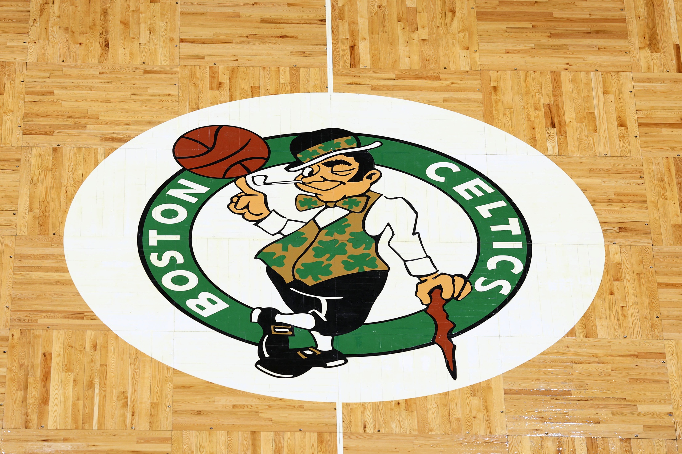 The Boston Celtics logo is seen on the parquet floor at center court before the game between the Boston Celtics and the Washington Wizards at TD Garden.