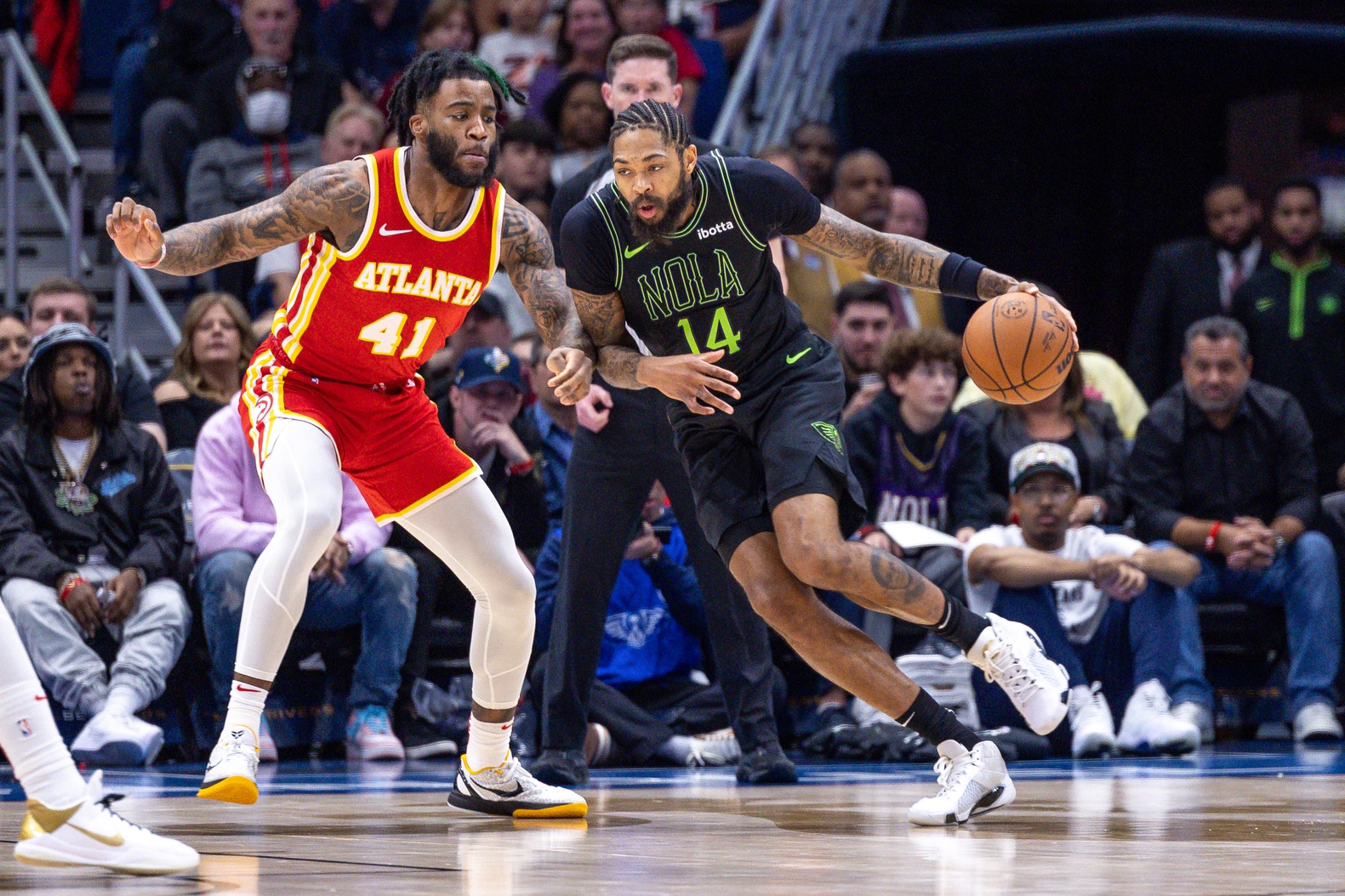 Nov 4, 2023; New Orleans, Louisiana, USA; New Orleans Pelicans forward Brandon Ingram (14) dribbles against Atlanta Hawks forward Saddiq Bey (41) during the first half at Smoothie King Center. Mandatory Credit: Stephen Lew-USA TODAY Sports