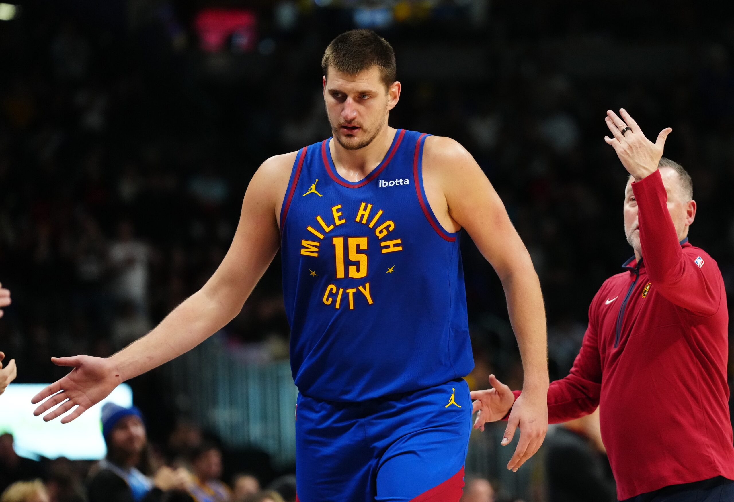 Denver Nuggets center Nikola Jokic (15) leaves the court in the fourth quarter against the Chicago Bulls at Ball Arena.