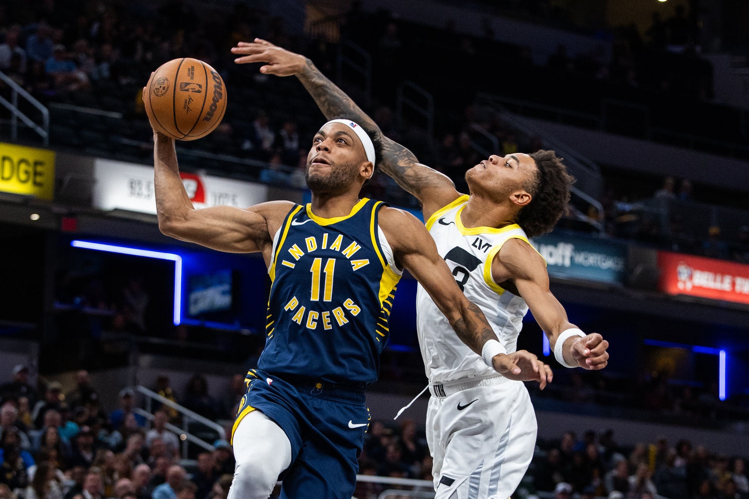 Indiana Pacers forward Bruce Brown (11) shoots the ball while Utah Jazz guard Keyonte George (3) defends in the second half at Gainbridge Fieldhouse.