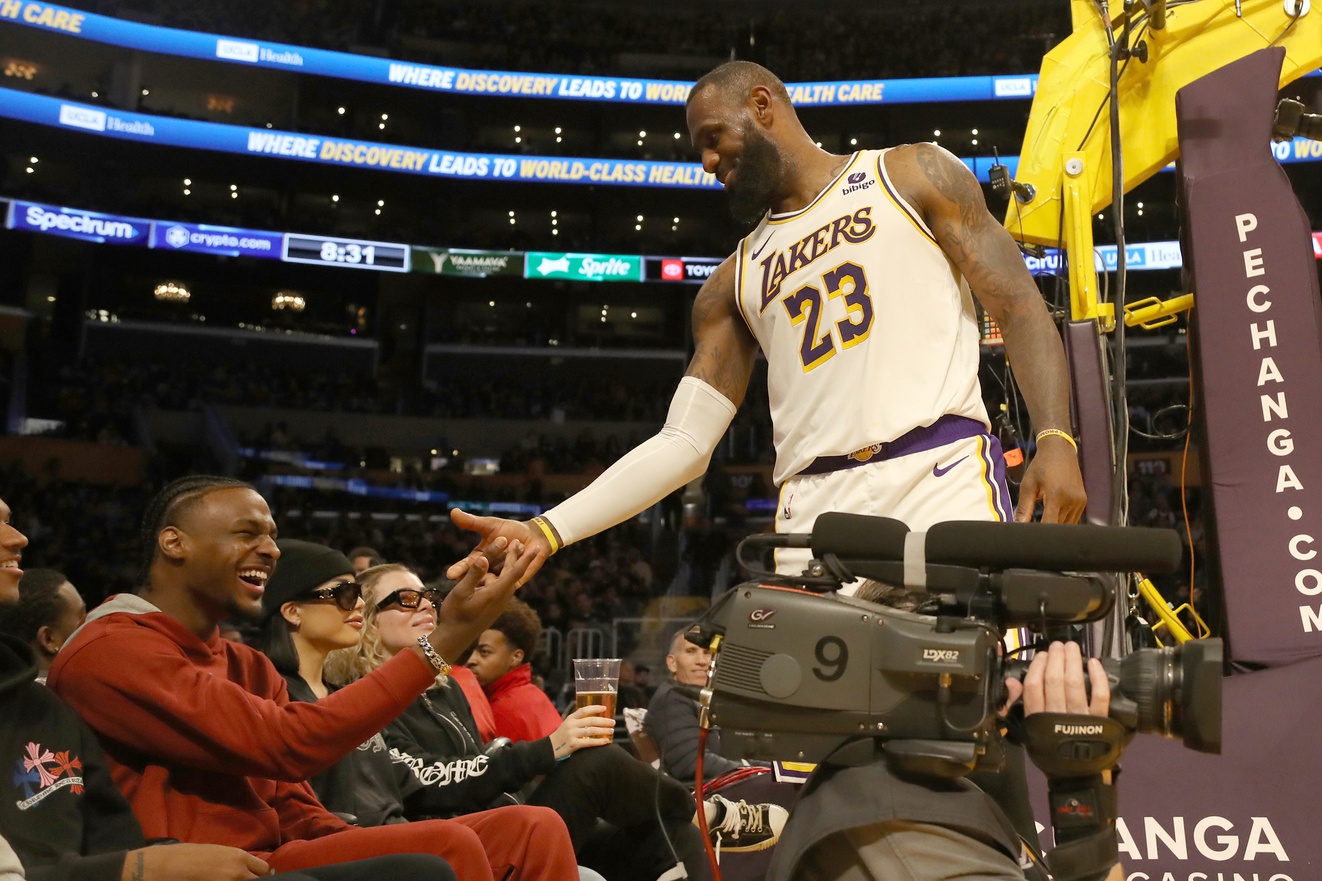 Los Angeles Lakers forward LeBron James (23) shakes hands with his son Bronny James during the second half against the Houston Rockets at Crypto.com Arena.