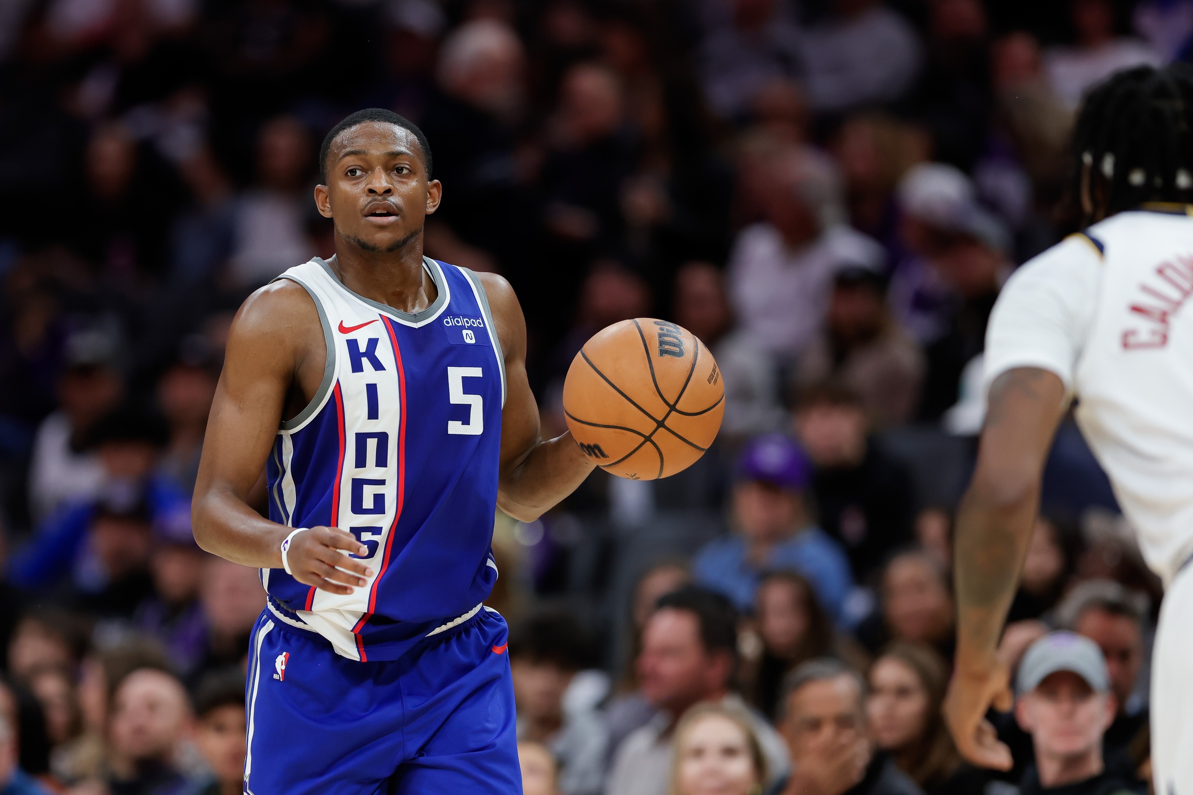 Dec 2, 2023; Sacramento, California, USA; Sacramento Kings guard De'Aaron Fox (5) dribbles the ball up the court during the third quarter against the Denver Nuggets at Golden 1 Center. Mandatory Credit: Sergio Estrada-USA TODAY Sports