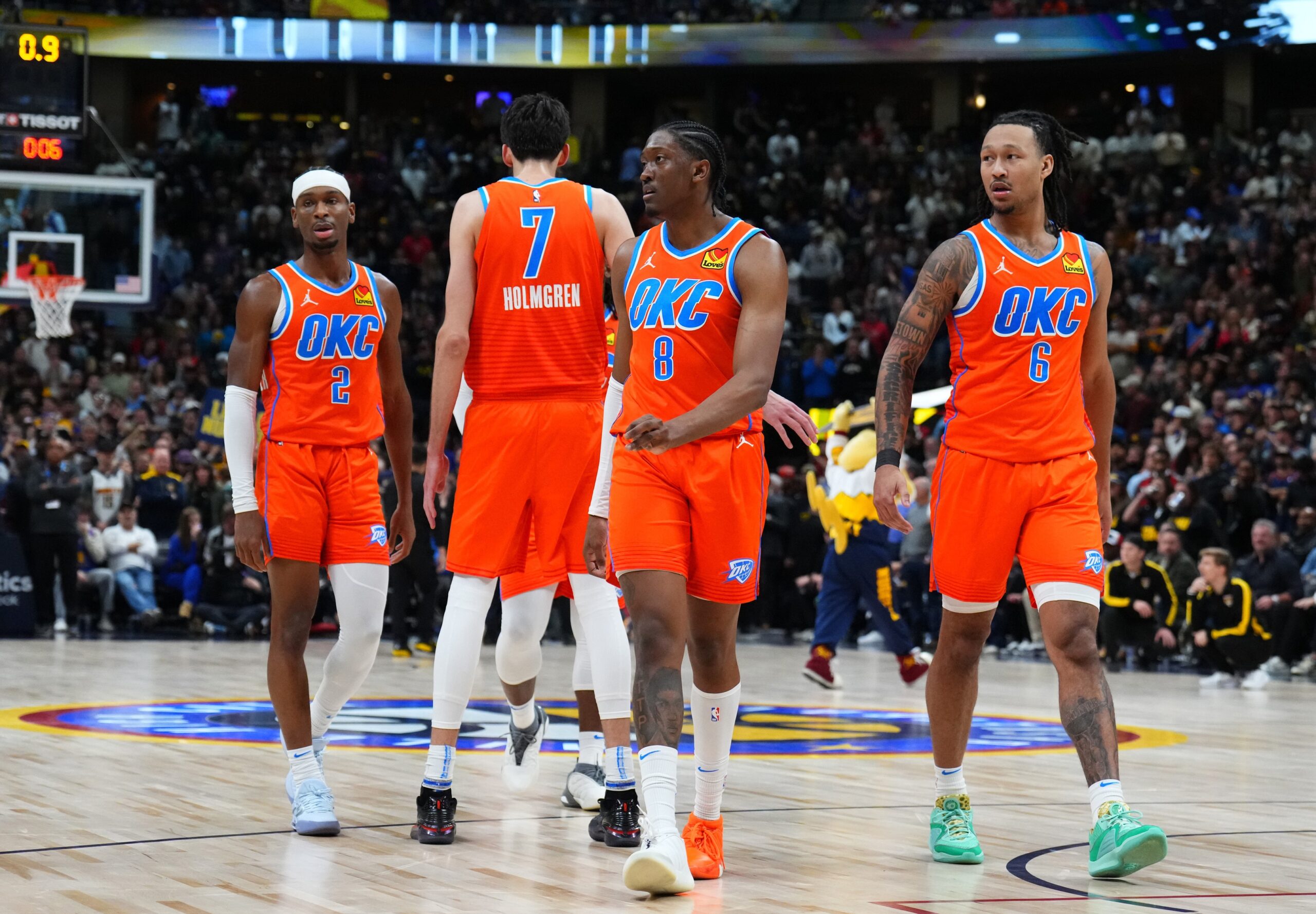 Oklahoma City Thunder guard Shai Gilgeous-Alexander (2) and forward Chet Holmgren (7) and forward Jalen Williams (8) and forward Jaylin Williams (6) break huddle in the fourth quarter against the Denver Nuggets at Ball Arena.