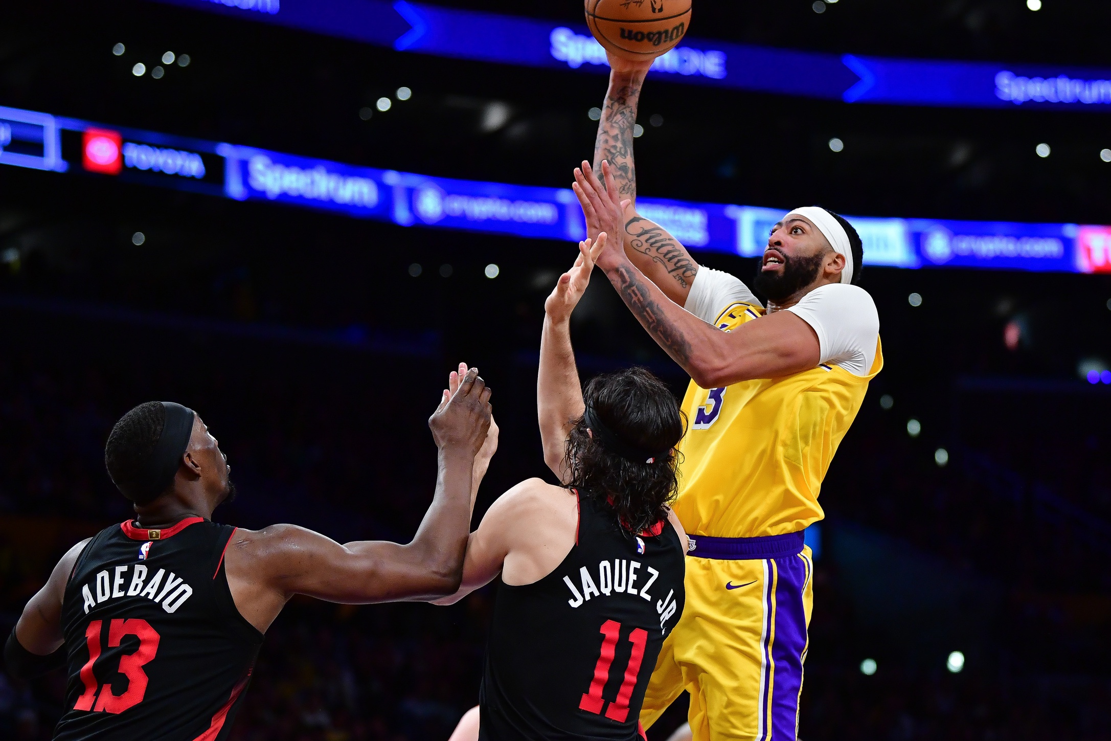 Jan 3, 2024; Los Angeles, California, USA; Los Angeles Lakers forward Anthony Davis (3) shoots against Miami Heat center Bam Adebayo (13) during the second half at Crypto.com Arena. Mandatory Credit: Gary A. Vasquez-USA TODAY Sports