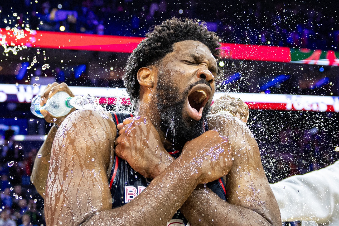 Jan 22, 2024; Philadelphia, Pennsylvania, USA; Philadelphia 76ers center Joel Embiid (21) is doused with water by teammates after scoring 70 points in a victory against the San Antonio Spurs at Wells Fargo Center. Mandatory Credit: Bill Streicher-USA TODAY Sports