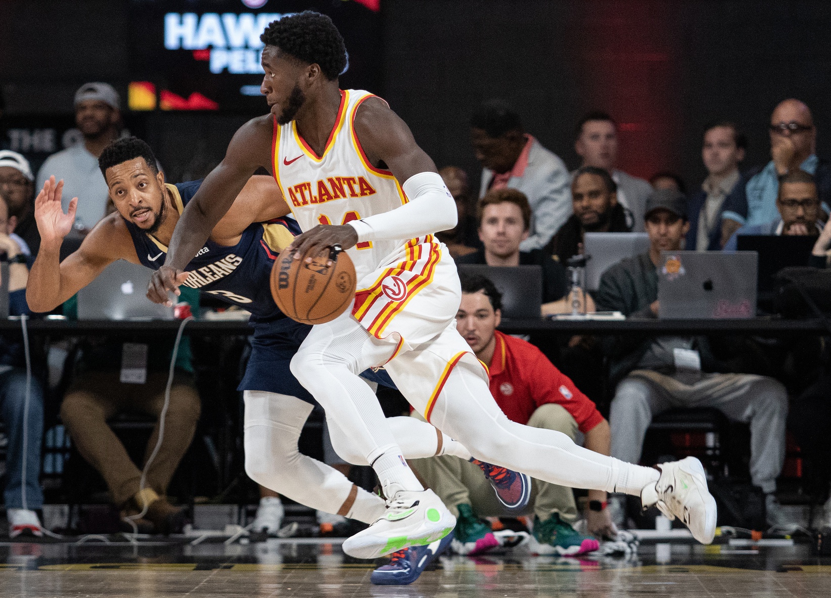 Atlanta Hawks forward AJ Griffin (14) drives the ball against New Orleans Pelicans guard CJ McCollum (3) during the third quarter at Gateway Center Arena at College Park.