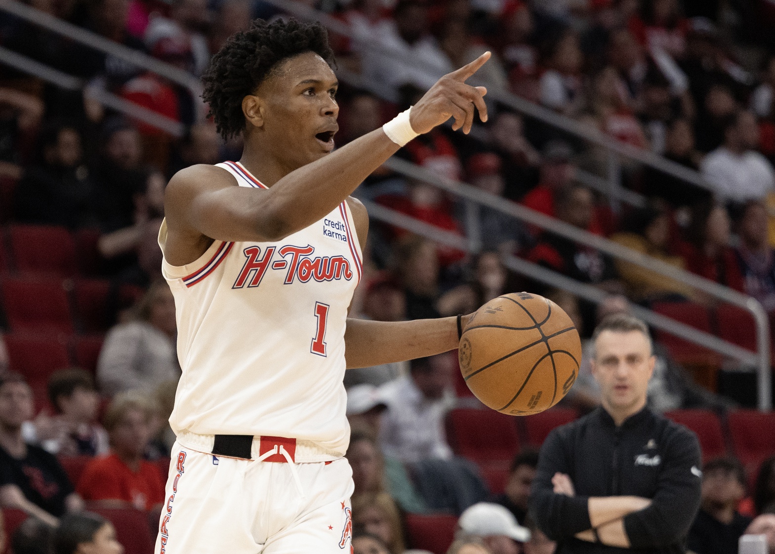 Houston Rockets forward Amen Thompson (1) reacts while dribbling against the Toronto Raptors in the fourth quarter at Toyota Center.