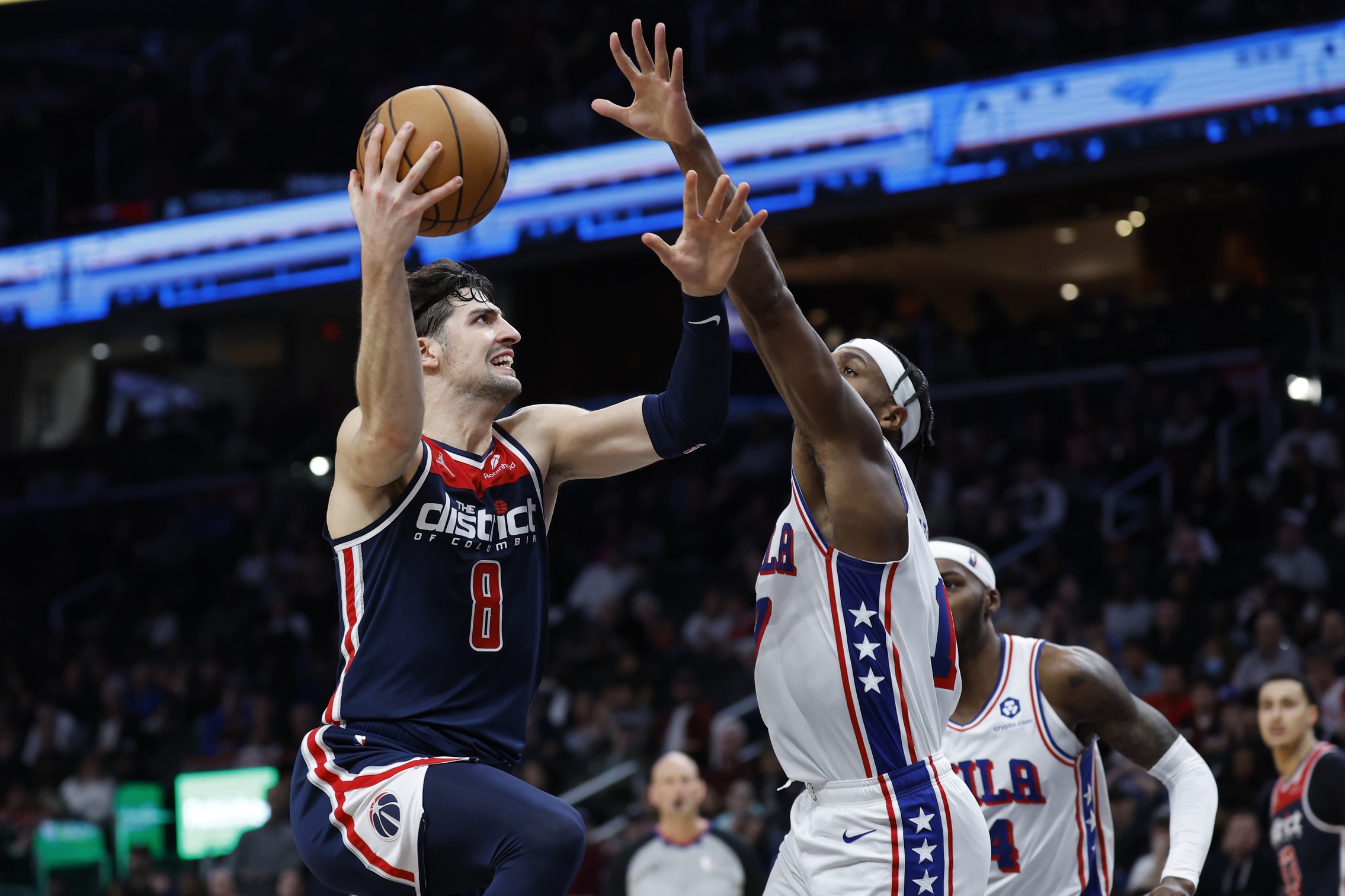 Feb 10, 2024; Washington, District of Columbia, USA; Washington Wizards forward Deni Avdija (8) shoots the ball as Philadelphia 76ers guard Buddy Heeled (17) defends in the second half at Capital One Arena. Mandatory Credit: Geoff Burke-USA TODAY Sports