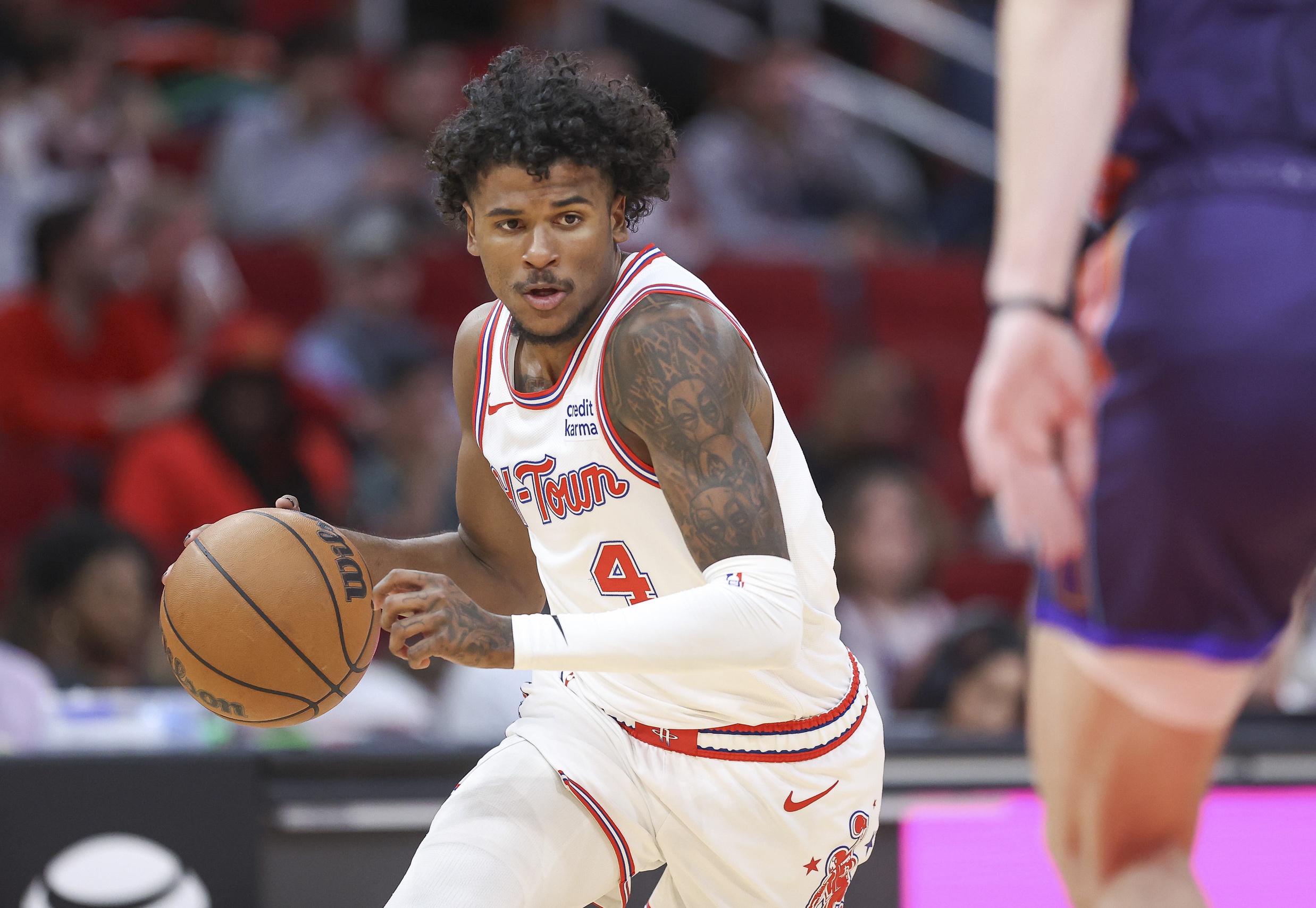 Houston Rockets guard Jalen Green (4) dribbles the ball during the first quarter against the Phoenix Suns at Toyota Center.