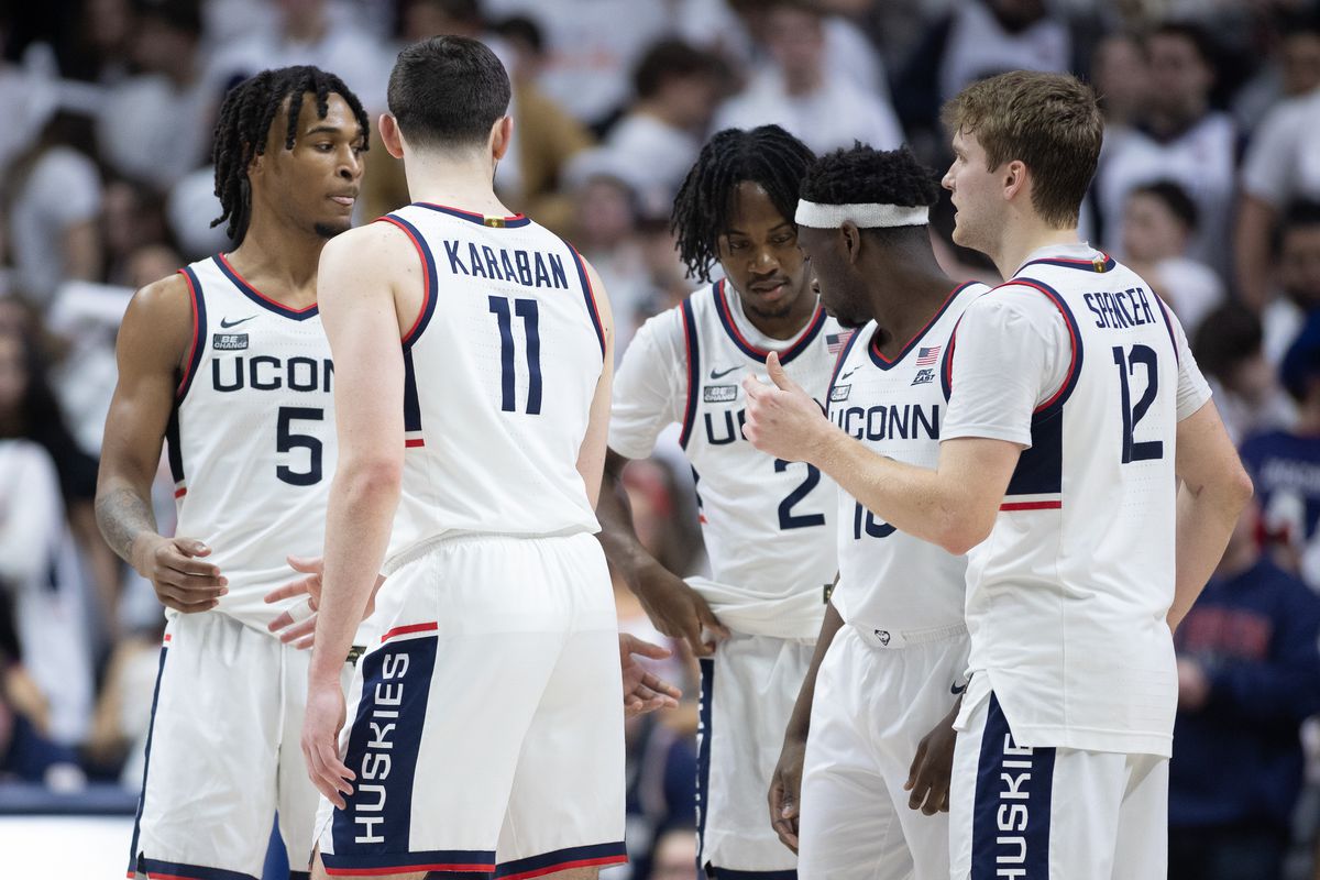 Crieghton men's basketball huddling during game action