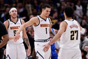 Denver Nuggets forward Michael Porter Jr celebrates with Jamal Murray