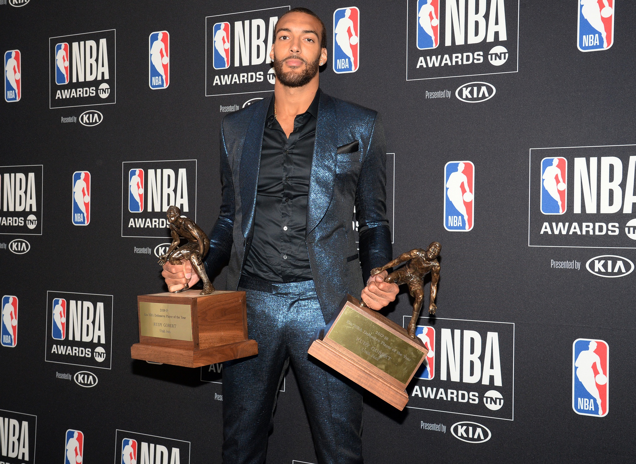 Rudy Gobert holds up Defensive Player of the Year Award at NBA Awards presentation