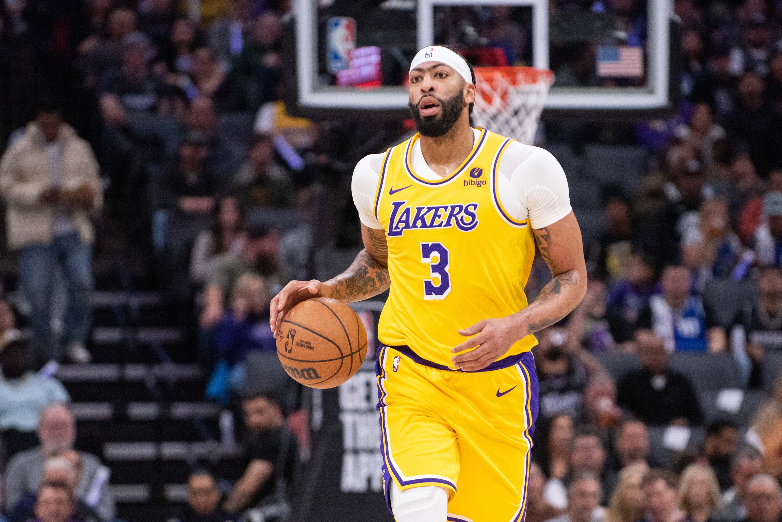 Mar 13, 2024; Sacramento, California, USA; Los Angeles Lakers forward Anthony Davis (3) pushes the ball up the court during the second quarter against the Sacramento Kings at Golden 1 Center. Mandatory Credit: Ed Szczepanski-USA TODAY Sports