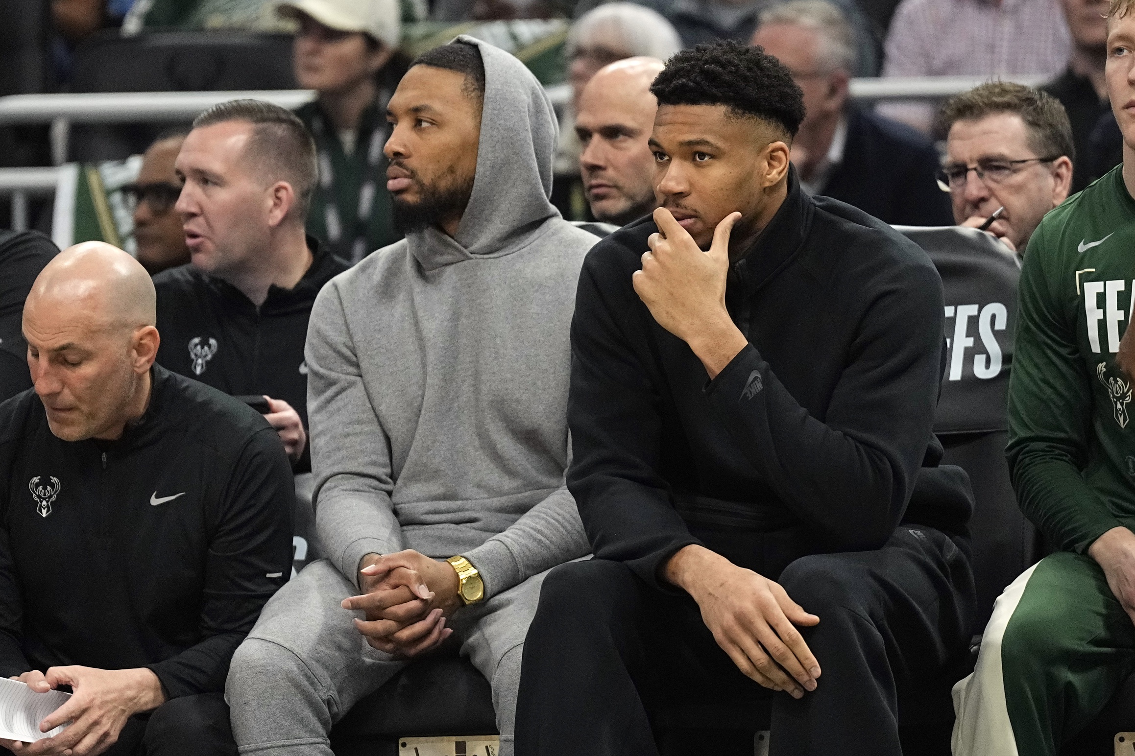 Milwaukee Bucks stars Damian Lillard and Giannis Antetokounmpo, out with injury during an elimination game