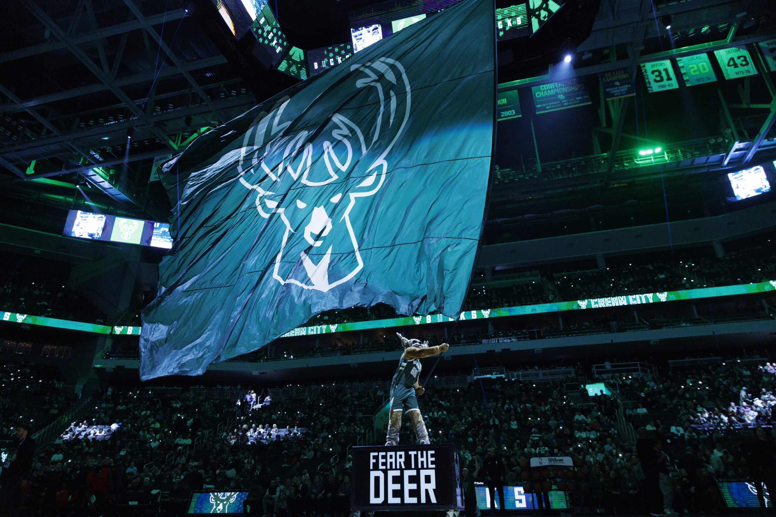 Dec 11, 2023; Milwaukee, Wisconsin, USA; Milwaukee Bucks mascot Bango waves flag with the Milwaukee Bucks logo prior to the game against the Chicago Bulls at Fiserv Forum. Mandatory Credit: Jeff Hanisch-USA TODAY Sports