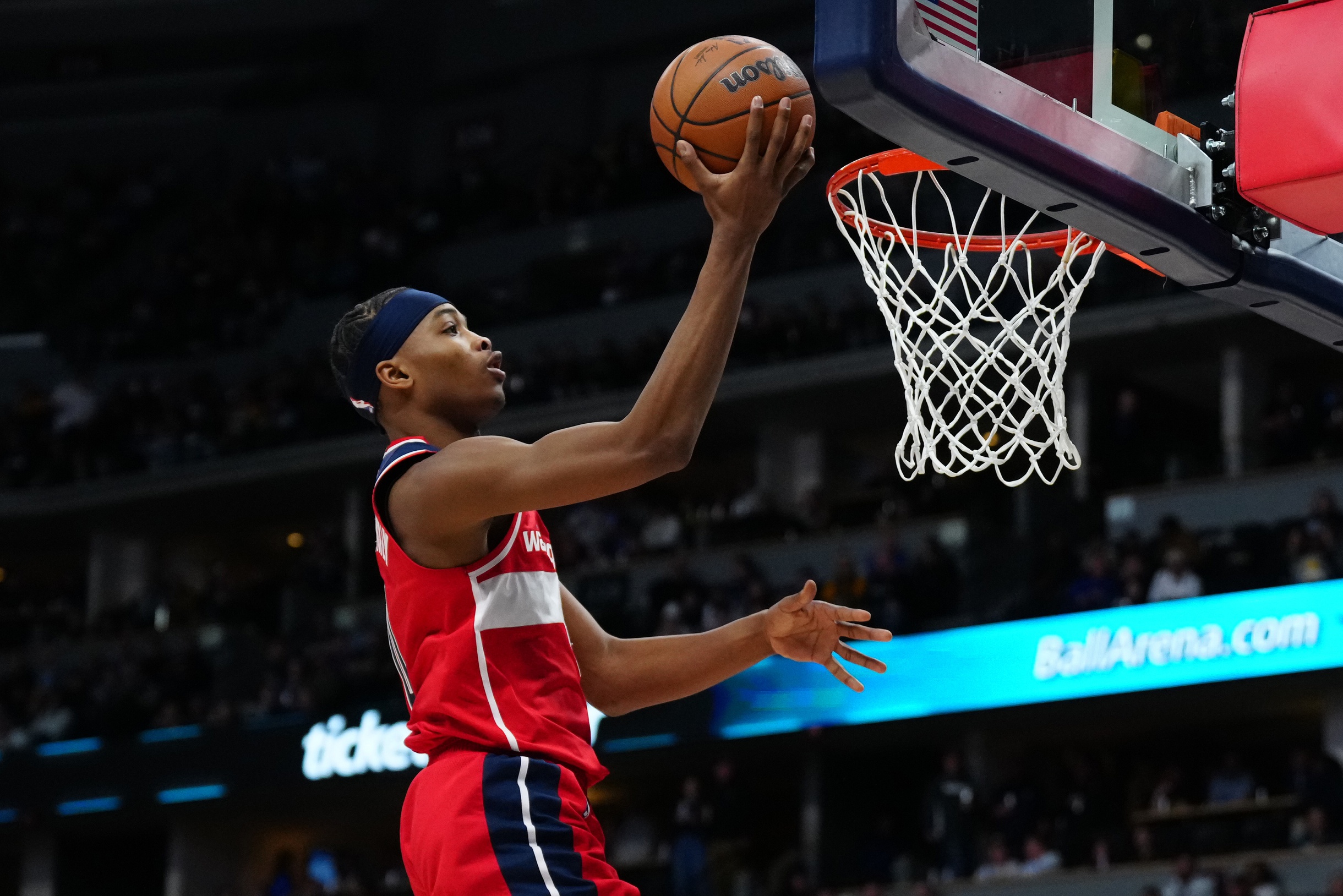 Feb 22, 2024; Denver, Colorado, USA; Washington Wizards guard Bilal Coulibaly (0) finishes off a basket in the second half against the Denver Nuggets at Ball Arena. Mandatory Credit: Ron Chenoy-USA TODAY Sports