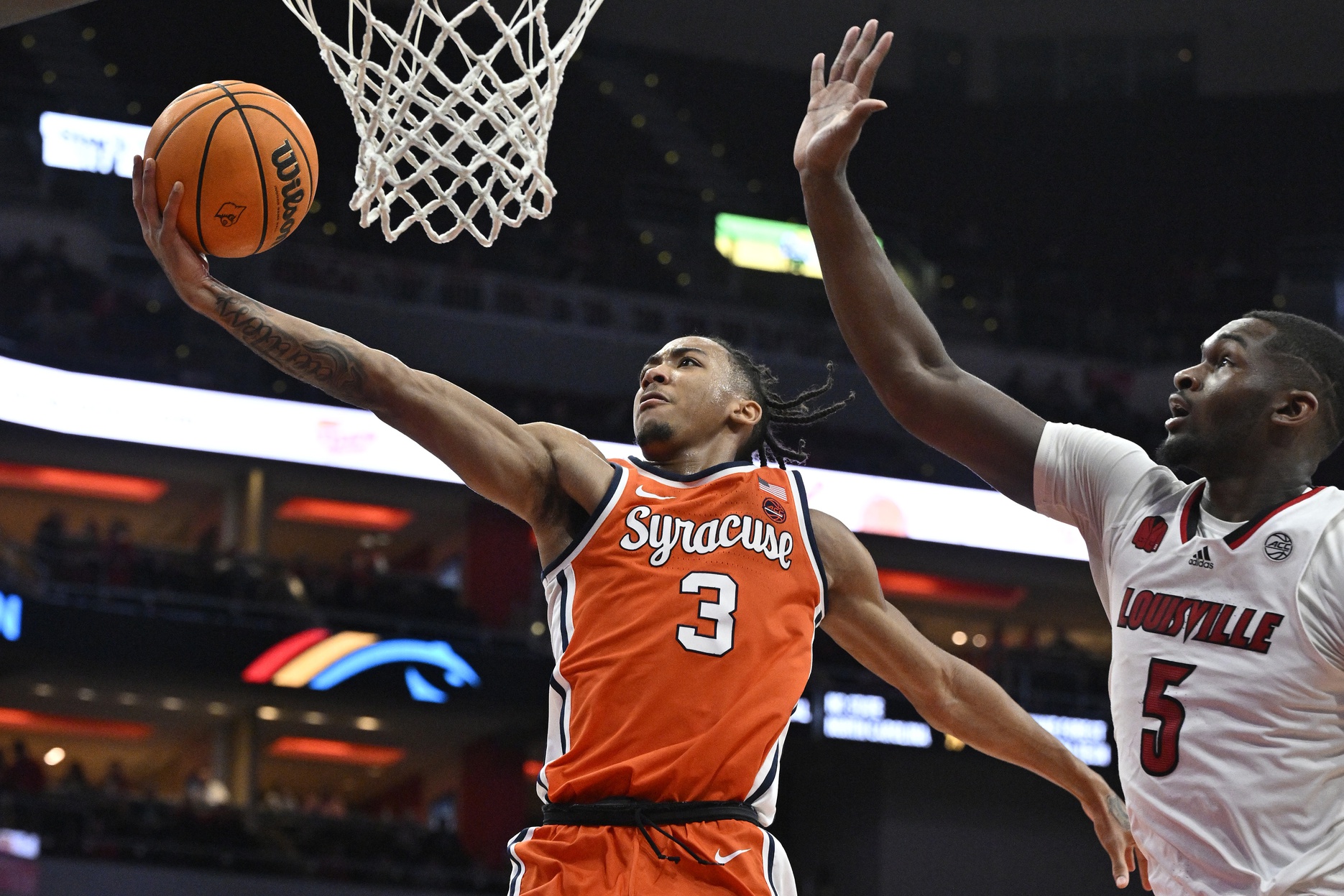 Syracuse Orange guard Judah Mintz (3) shoots against Louisville Cardinals forward Brandon Huntley-Hatfield (5) during the first half at KFC Yum! Center.