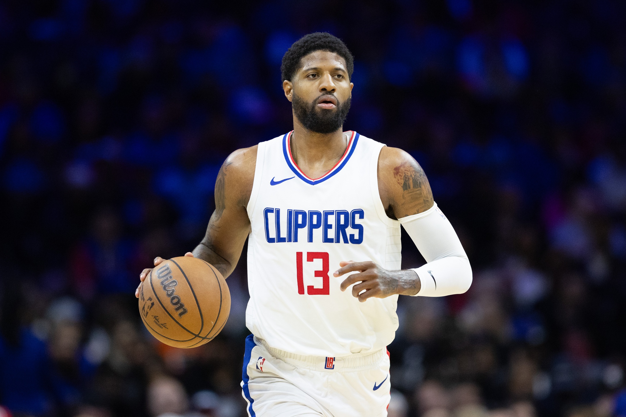 LA Clippers forward Paul George (13) dribbles the ball against the Philadelphia 76ers during the fourth quarter at Wells Fargo Center.