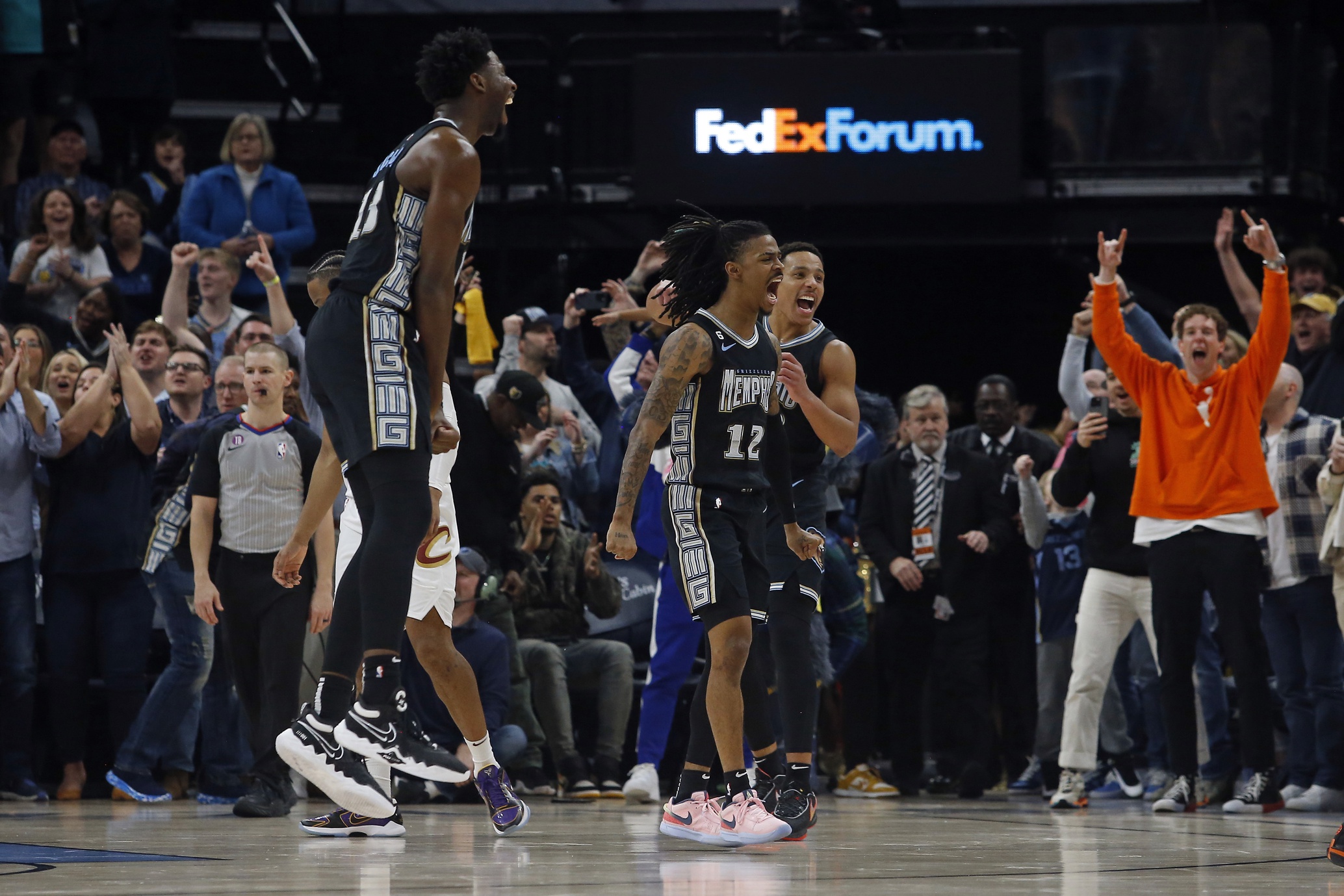 Memphis Grizzlies guard Ja Morant (12), guard Desmond Bane (22) and forward Jaren Jackson Jr. (13)