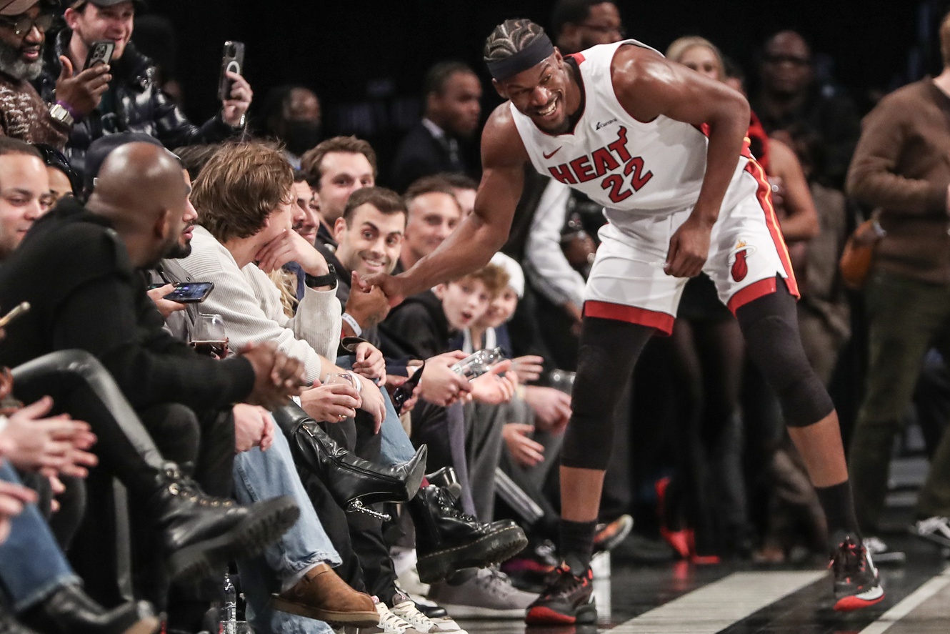 Miami Heat forward Jimmy Butler shakes hands with Brooklyn Nets fan