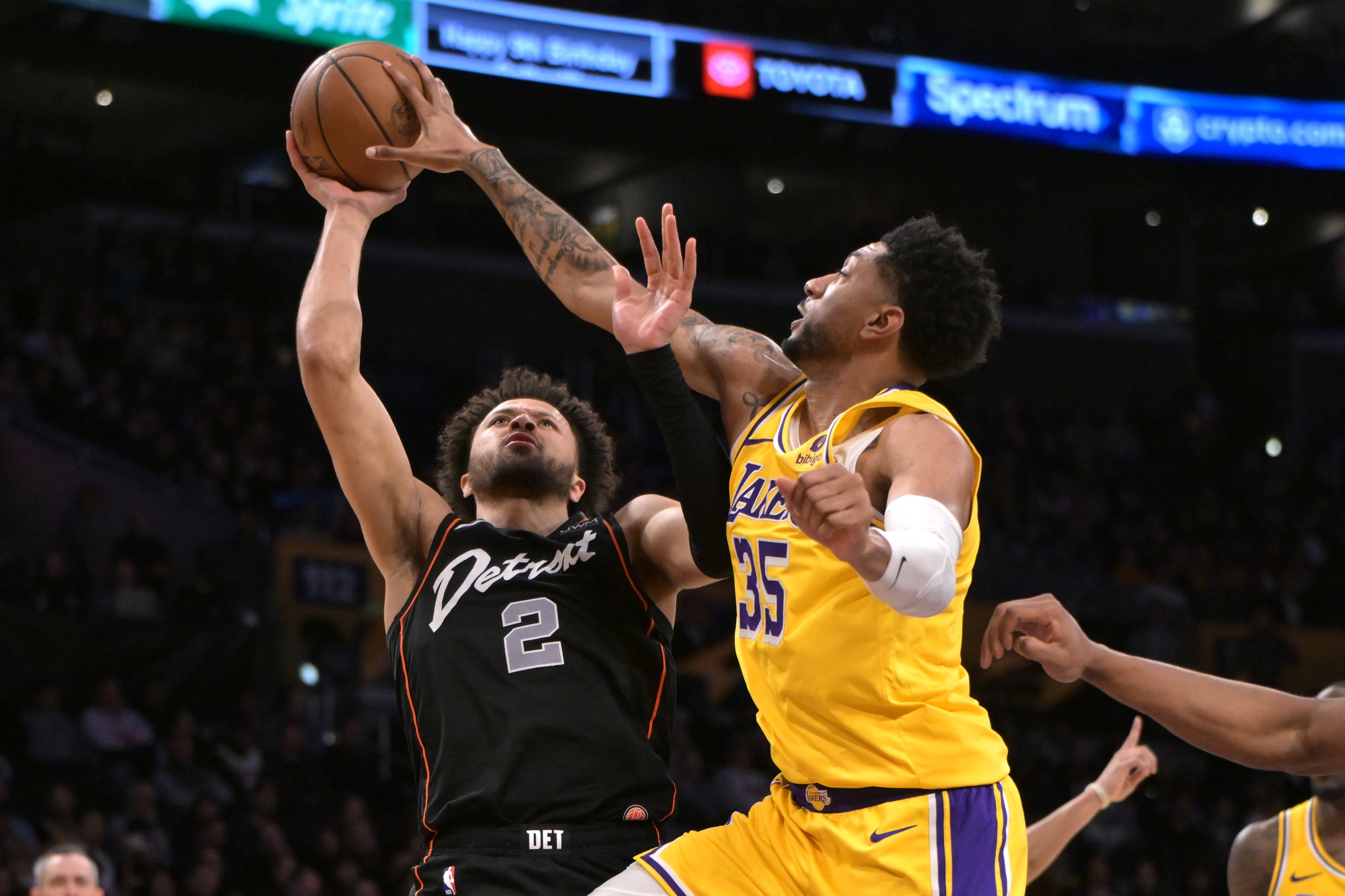 Feb 13, 2024; Los Angeles, California, USA; Los Angeles Lakers forward Christian Wood (35) blocks a shot by Detroit Pistons guard Cade Cunningham (2) in the second half at Crypto.com Arena. Mandatory Credit: Jayne Kamin-Oncea-USA TODAY Sports