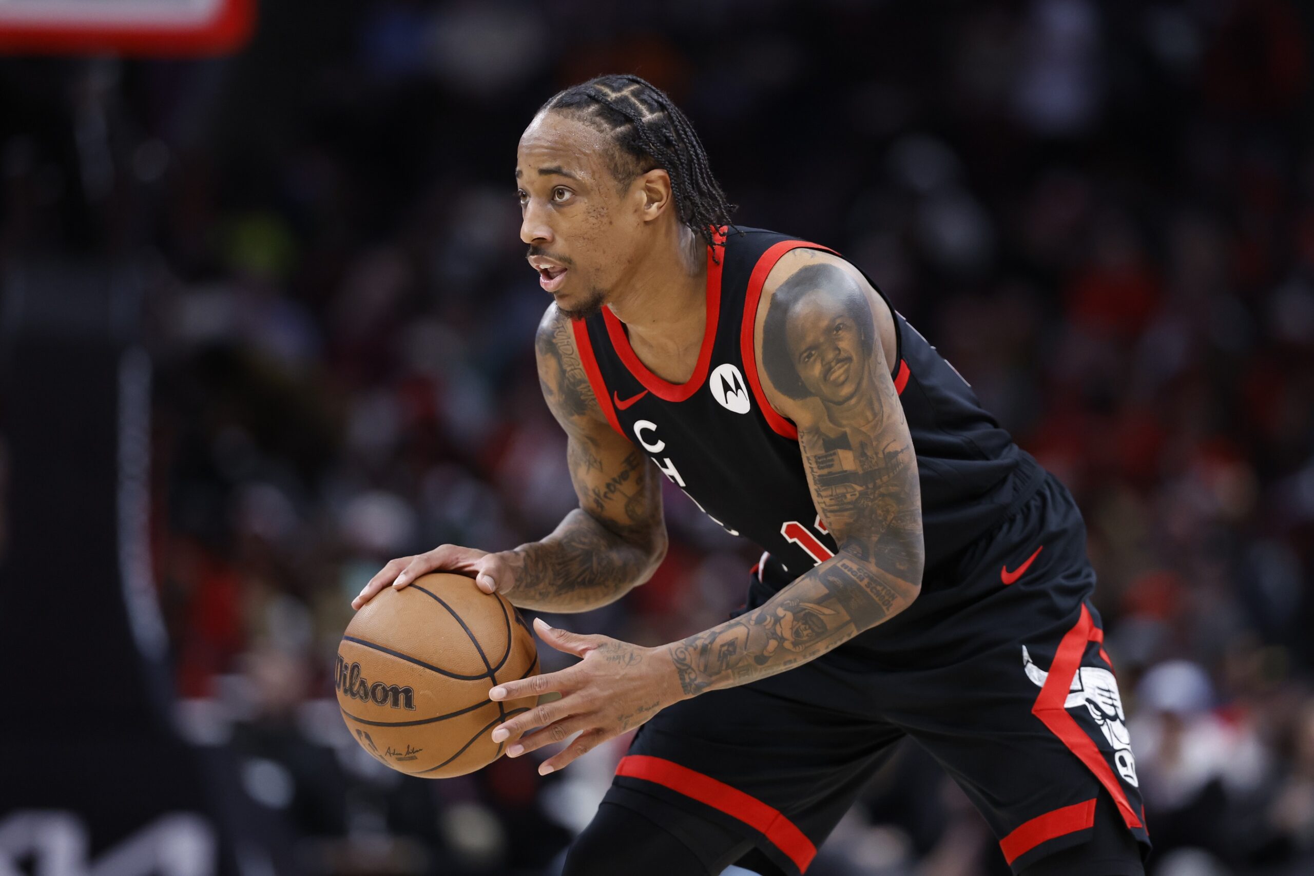 Chicago Bulls forward DeMar DeRozan (11) looks to pass the ball against the Atlanta Hawks during the first half at United Center.