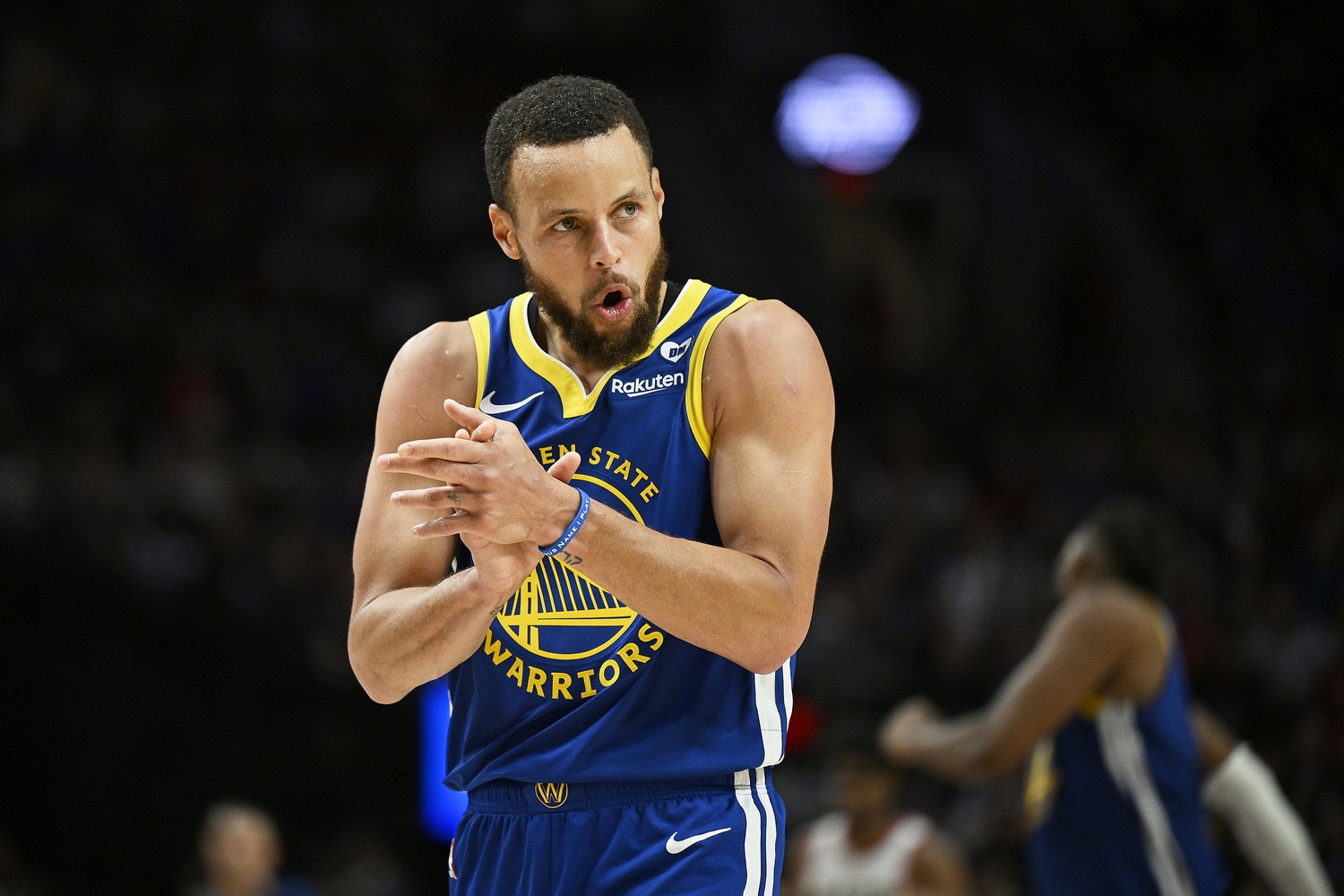 Golden State Warriors guard Stephen Curry (30) claps his hands in celebration during the second half against the Portland Trail Blazers at Moda Center.