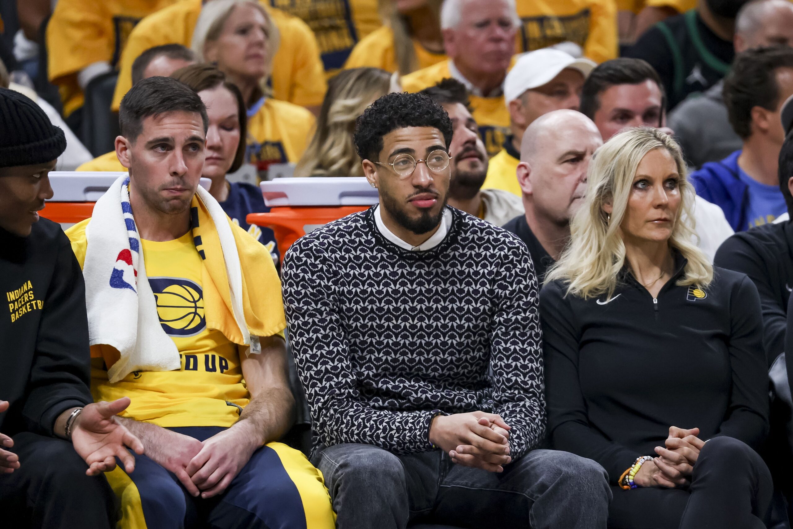 Indiana Pacers point guard Tyrese Haliburton surrounded by teammates on bench