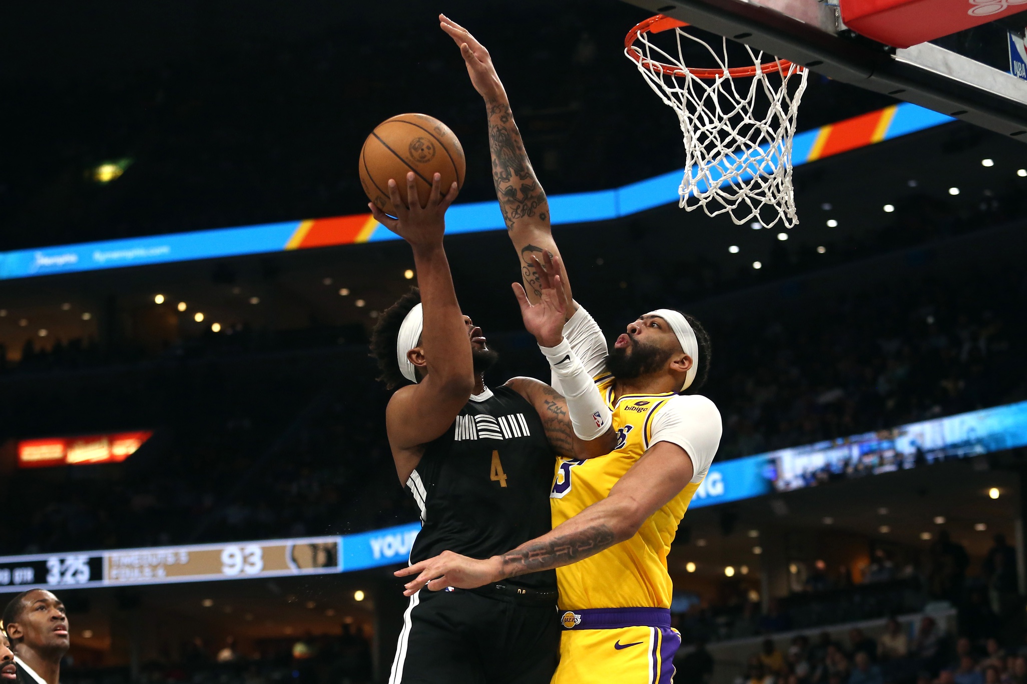 Apr 12, 2024; Memphis, Tennessee, USA; Los Angeles Lakers forward Anthony Davis (3) defends as Memphis Grizzlies guard Jordan Goodwin (4) drives to the basket during the second half at FedExForum. Mandatory Credit: Petre Thomas-USA TODAY Sports