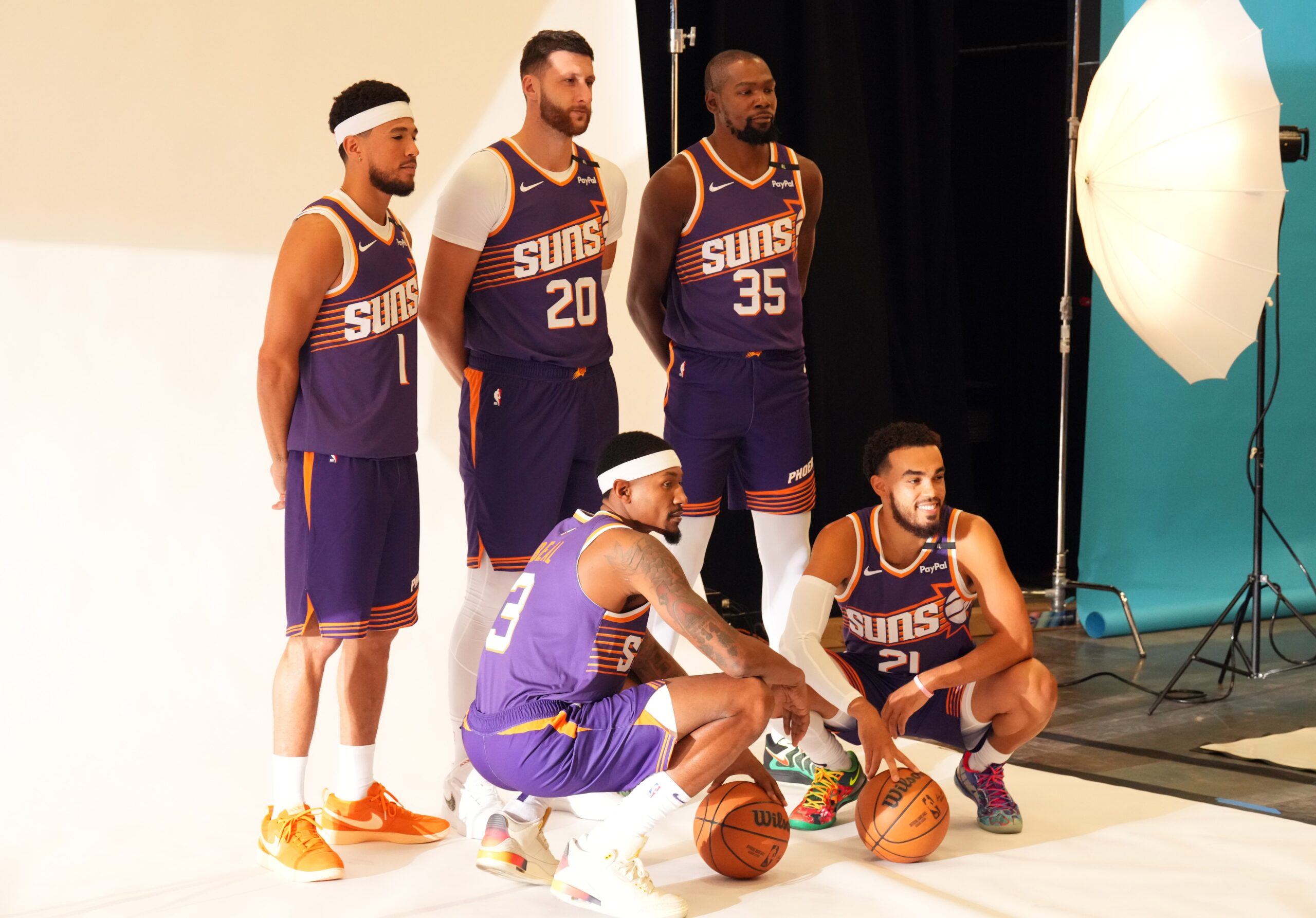 Sep 30, 2024; Phoenix, AZ, USA; Phoenix Suns guard Devin Booker (1) and Phoenix Suns center Jusuf Nurkic (20) and Phoenix Suns forward Kevin Durant (35) and Phoenix Suns guard Bradley Beal (3) and Phoenix Suns guard Tyus Jones (21) pose for a photo during Media Day at Footprint Center. Mandatory Credit: Joe Camporeale-Imagn Images