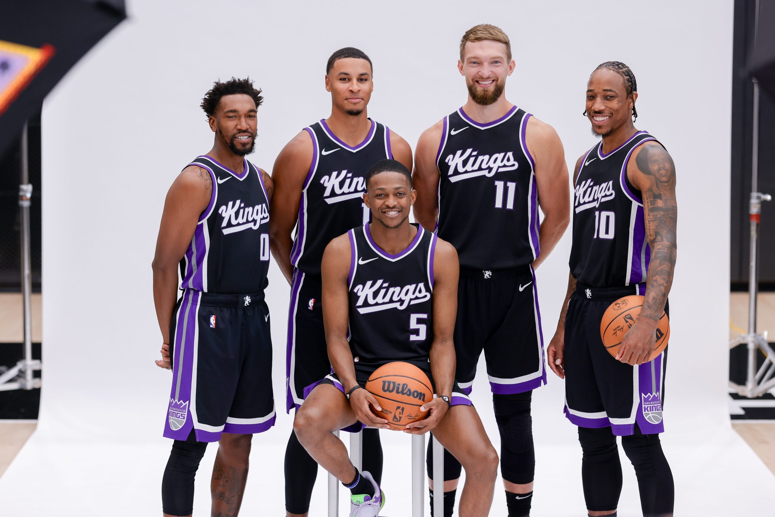 Sacramento Kings guard Malik Monk (0) and forward Keegan Murray (13) and forward Domantas Sabonis (11) and forward DeMar DeRozan (10) and guard De'Aaron Fox (5) pose for a photo during media day