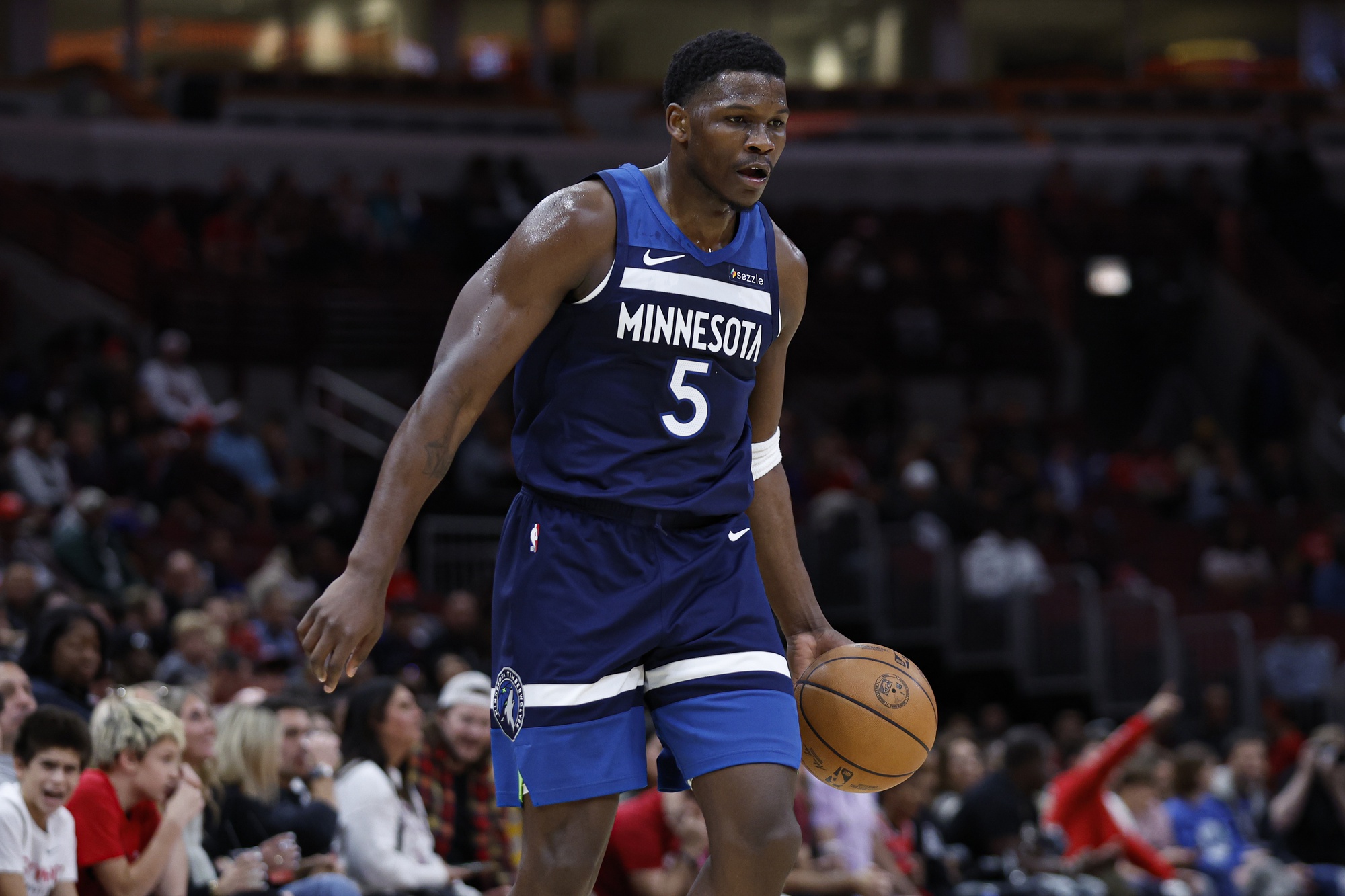 Minnesota Timberwolves wing Anthony Edwards (5) brings the ball up court