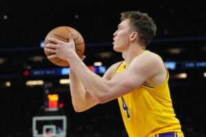 Los Angeles Lakers rookie guard Dalton Knecht (4) shoots the basketball