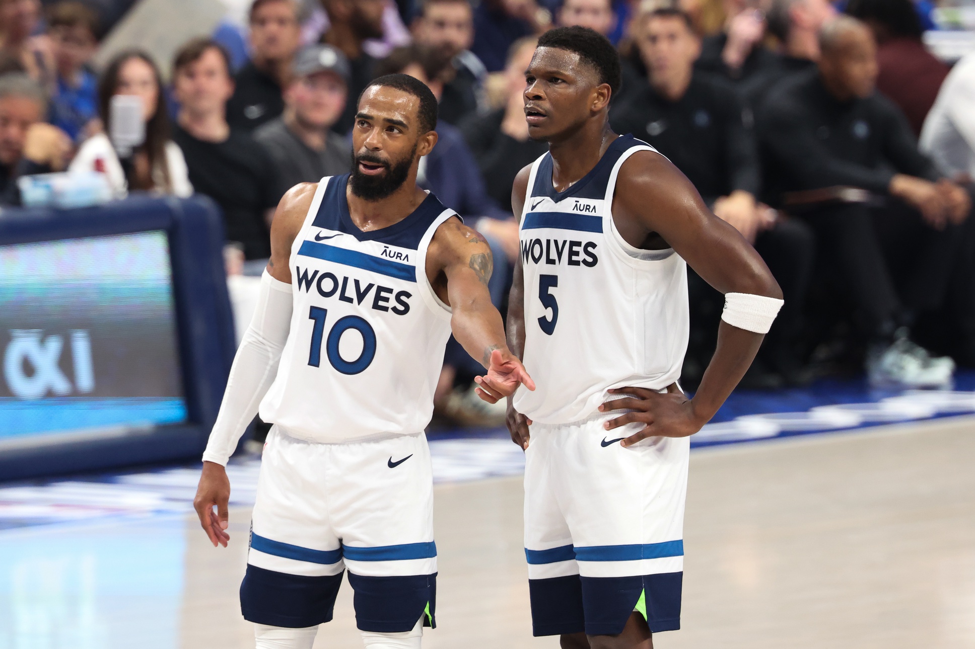 May 28, 2024; Dallas, Texas, USA; Minnesota Timberwolves guard Anthony Edwards (5) and guard Mike Conley (10) speak during the second quarter against the Dallas Mavericks in game four of the western conference finals for the 2024 NBA playoffs at American Airlines Center. Mandatory Credit: Kevin Jairaj-USA TODAY Sports