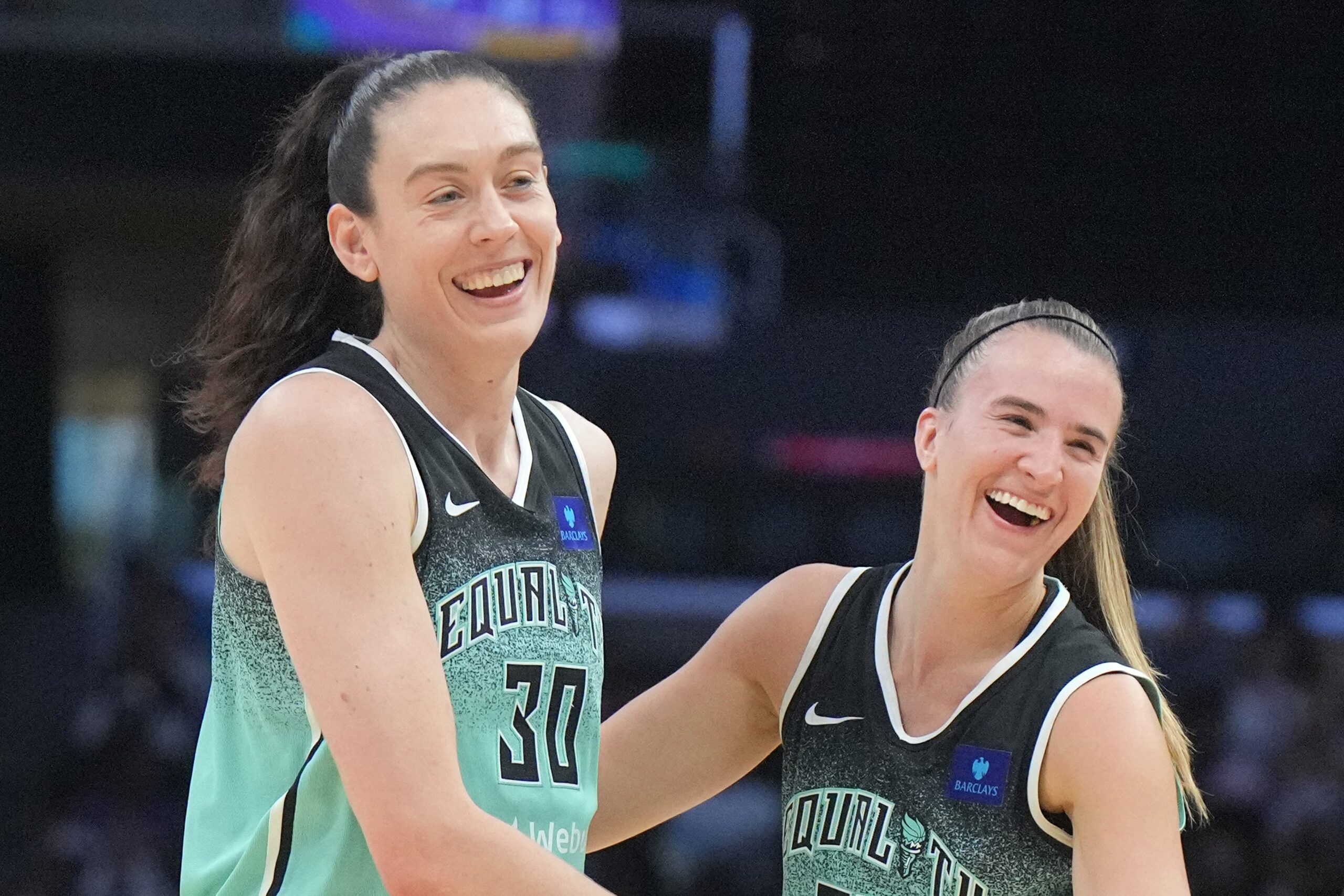 Aug 15, 2024; Los Angeles, California, USA; New York Liberty forward Breanna Stewart (30) and guard Sabrina Ionescu (20) celebrate in the first half against the LA Sparks Crypto.com Arena. Mandatory Credit: Kirby Lee-USA TODAY Sports