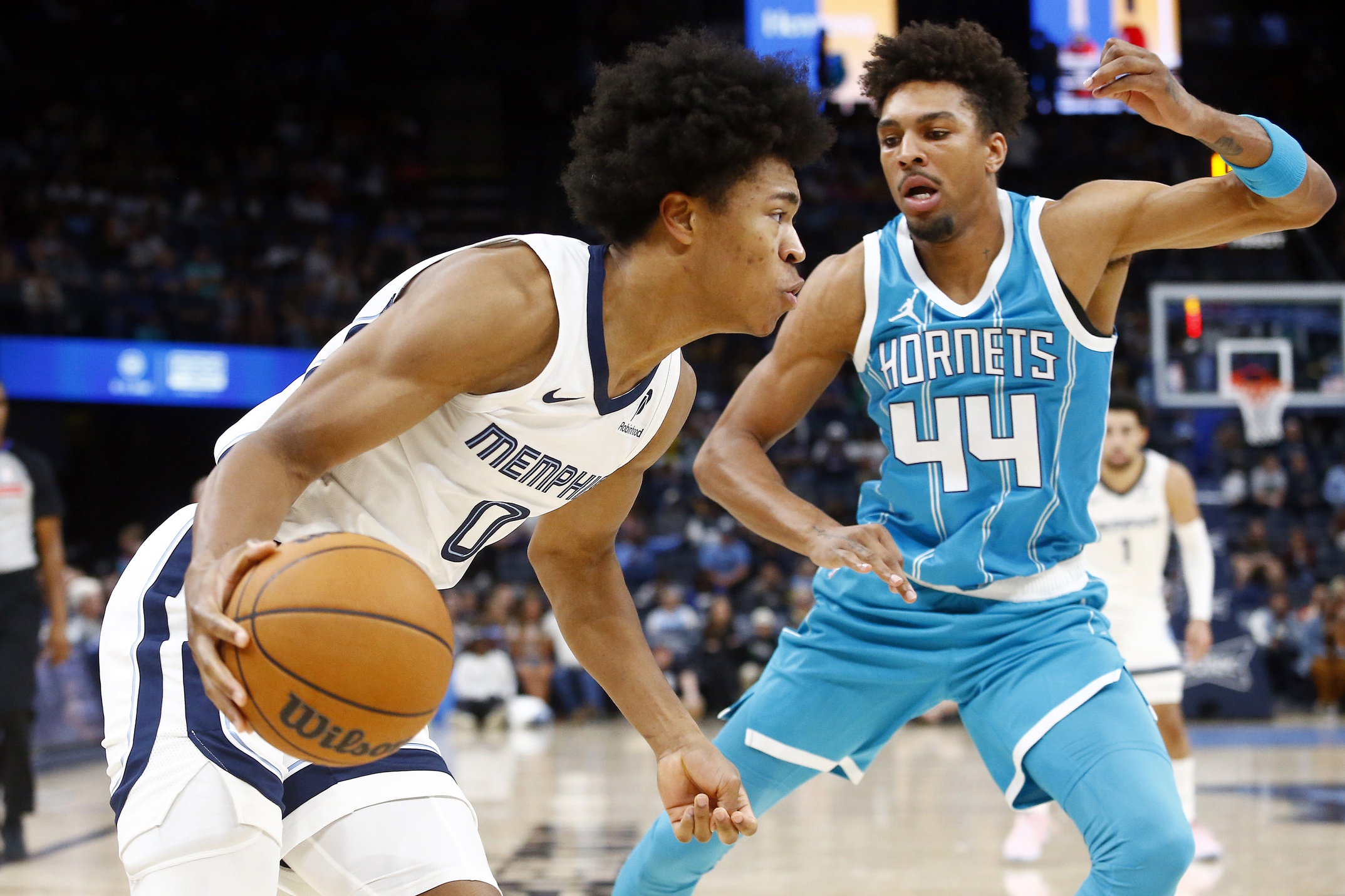 Oct 10, 2024; Memphis, Tennessee, USA; Memphis Grizzlies forward Jaylen Wells (0) drives to the basket as Charlotte Hornets guard Charlie Brown Jr. (44) defends during the second half at FedExForum. Mandatory Credit: Petre Thomas-Imagn Images