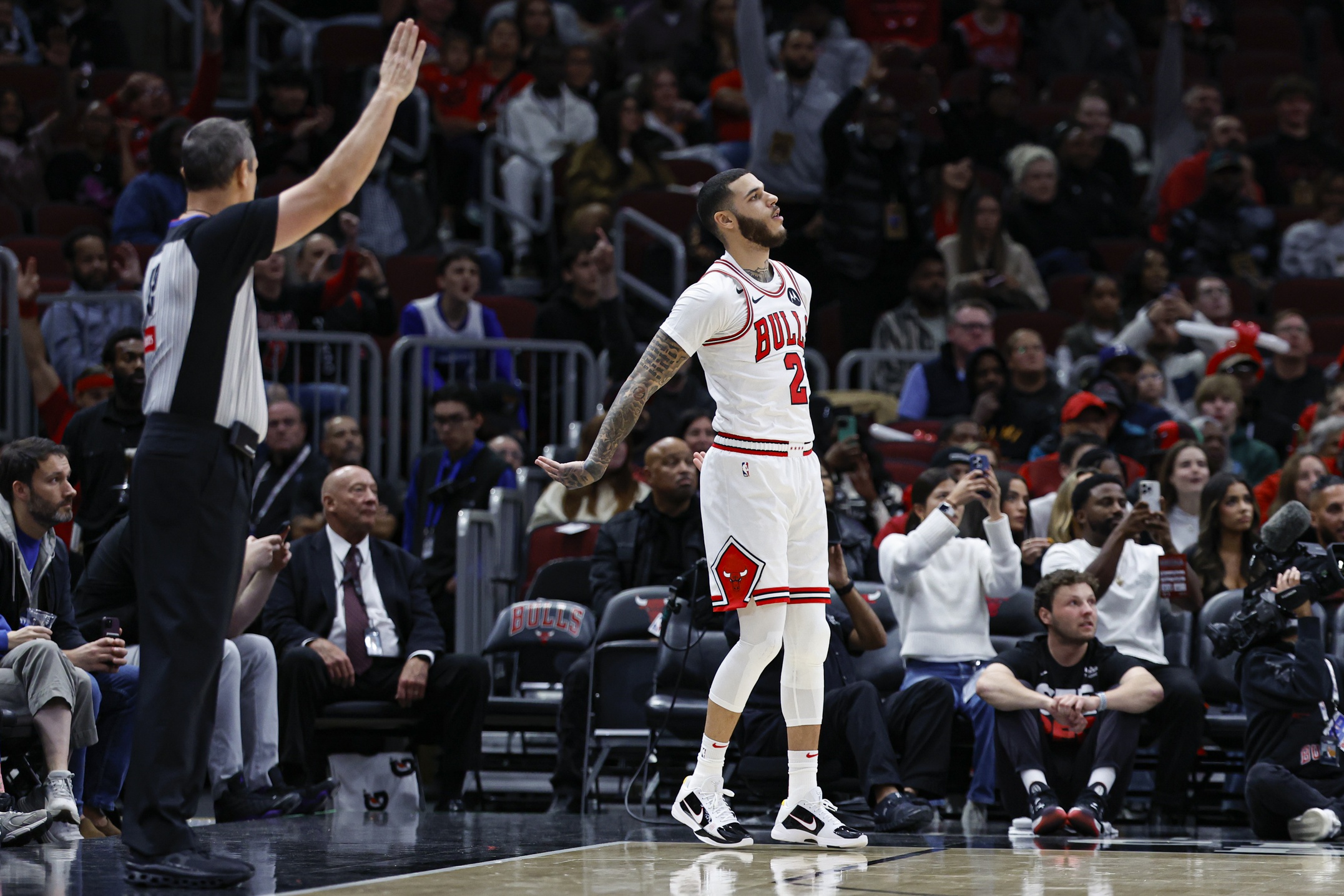 Oct 16, 2024; Chicago, Illinois, USA; Chicago Bulls guard Lonzo Ball (2) reacts after scoring a three-point basket against the Minnesota Timberwolves during the first half at United Center. Mandatory Credit: Kamil Krzaczynski-Imagn Images