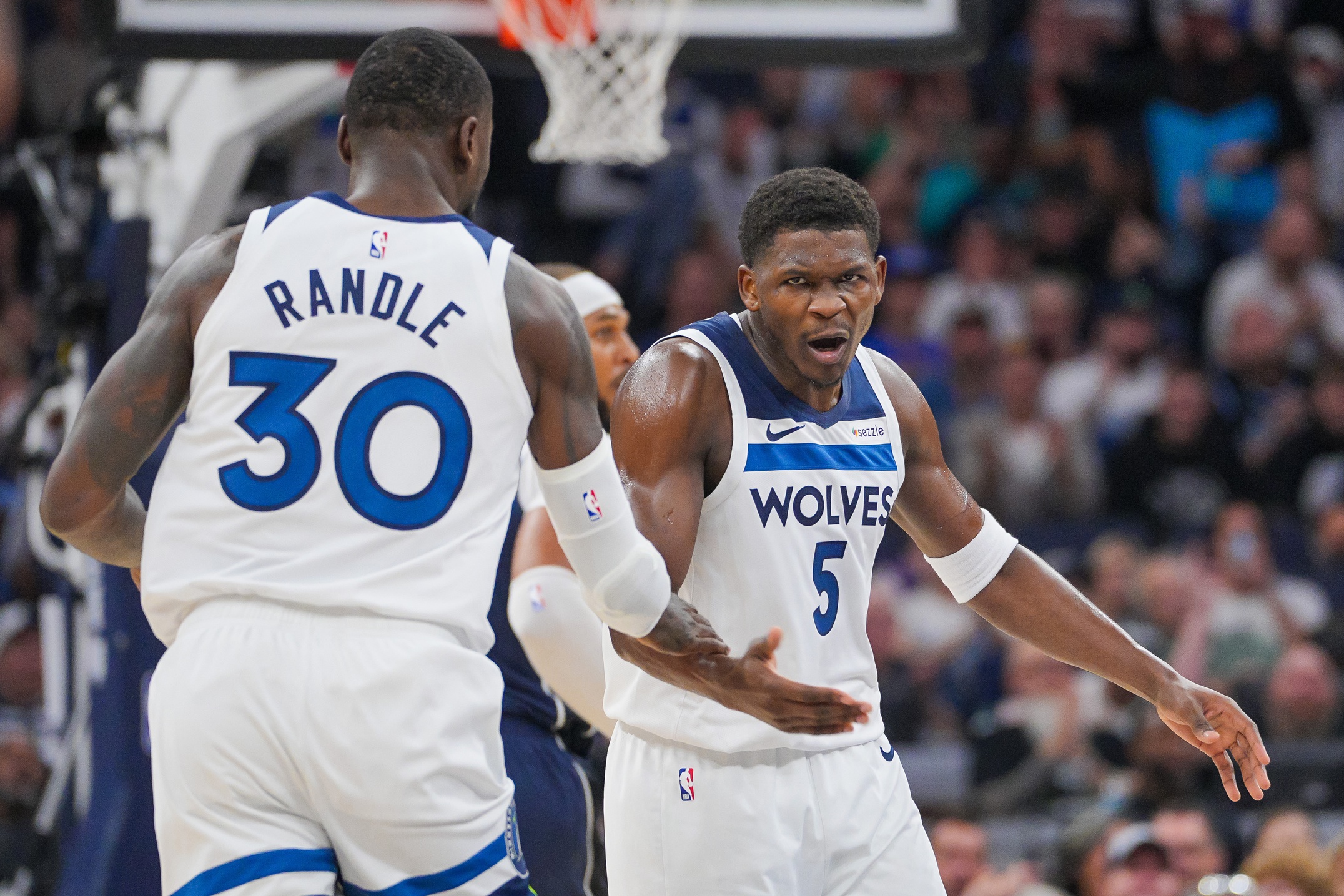 Minnesota Timberwolves guard Anthony Edwards celebrates his basket with forward Julius Randle