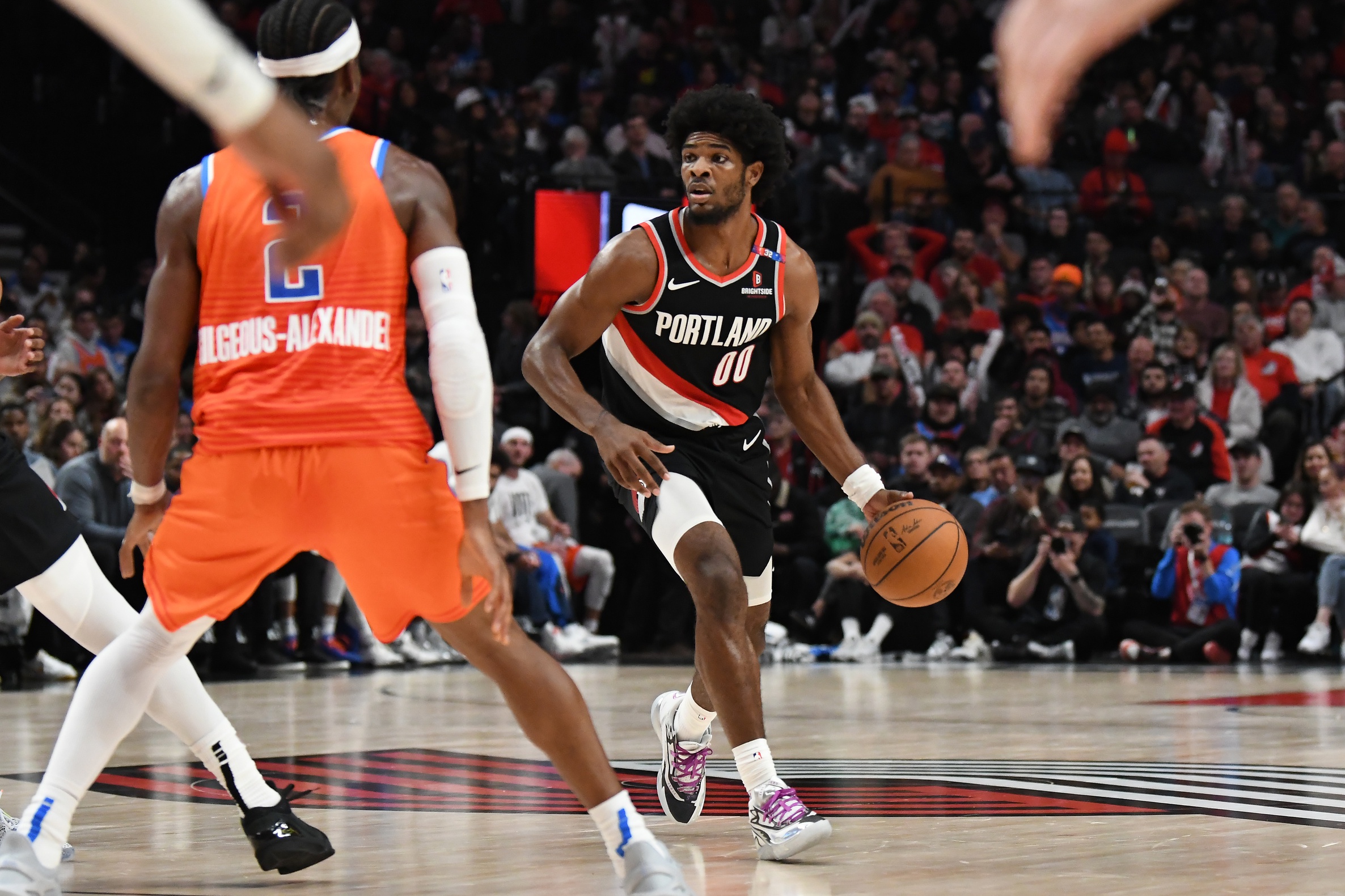 Portland Trail Blazers guard Scoot Henderson (00) brings the ball up court