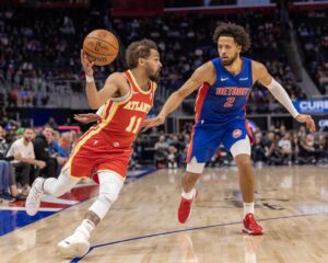 Atlanta Hawks guard Trae Young (11) moves the ball up court